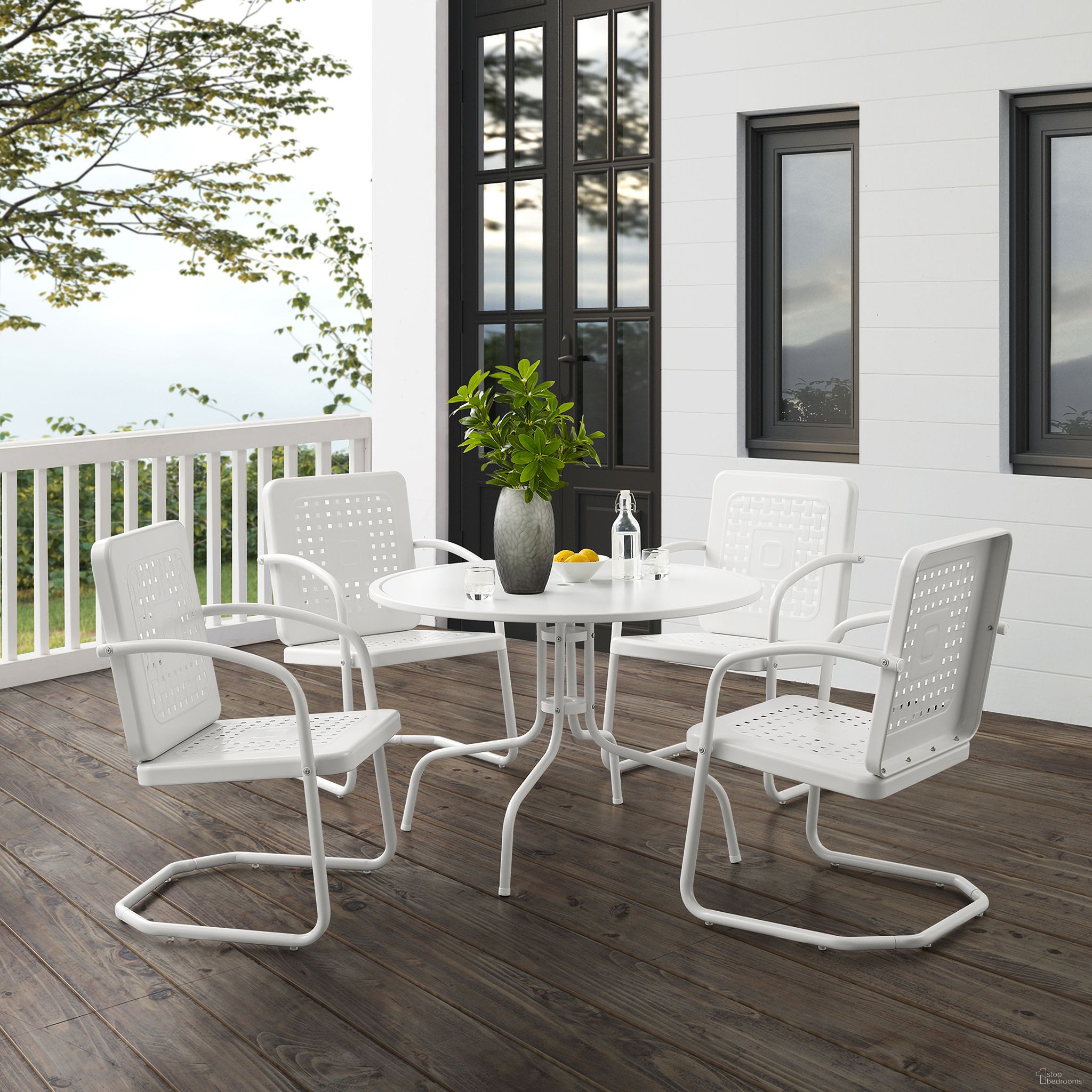 The appearance of Bates 5 Piece Round Retro Outdoor Dining Set In White Gloss and White Satin designed by Crosley Brands in the transitional interior design. This white gloss piece of furniture was selected by 1StopBedrooms from Bates Collection to add a touch of cosiness and style into your home. Sku: CO1012A-WH;CO1025-WH;CO1025-WH. Material: Steel.