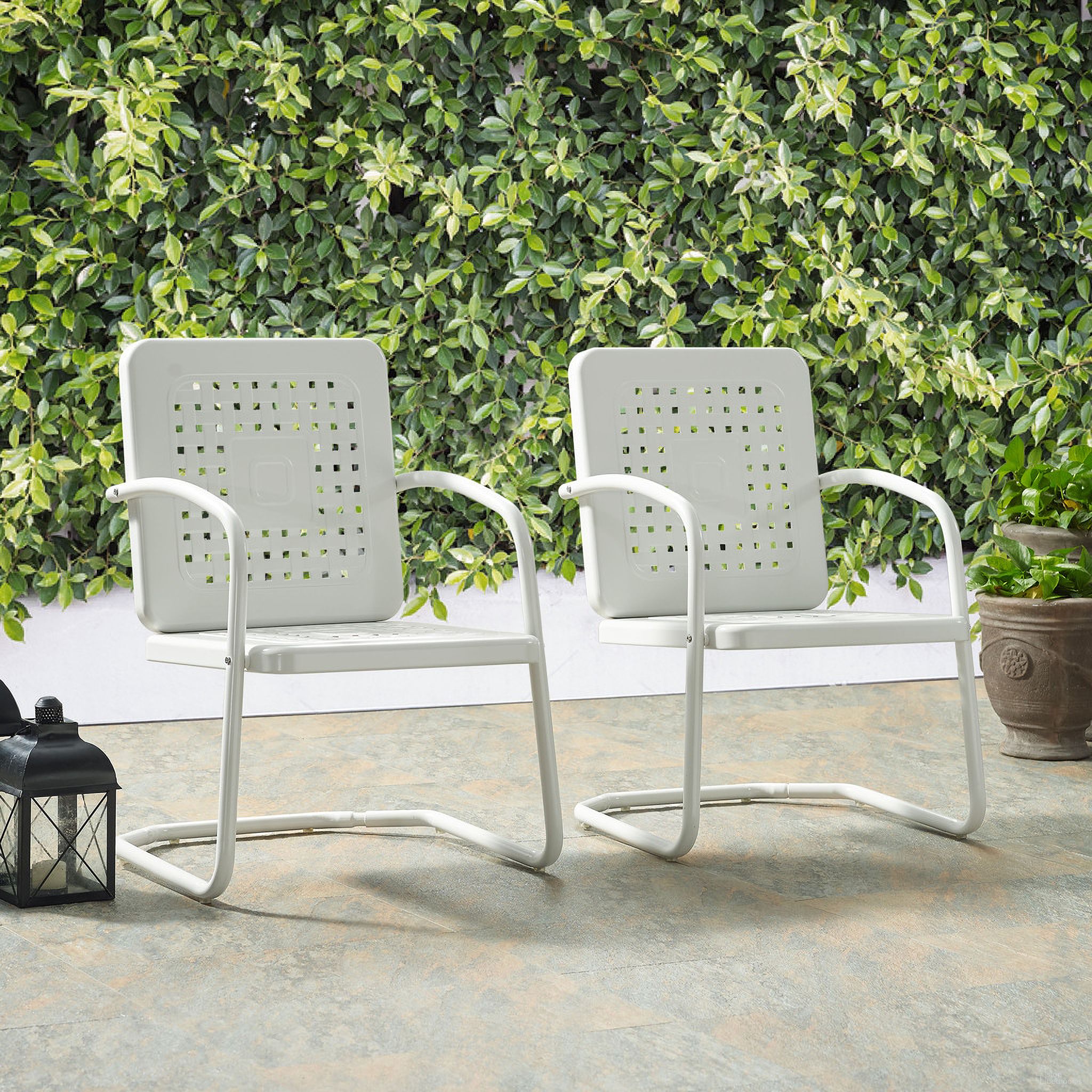 The appearance of Bates Retro Outdoor Chair In White Gloss - Set of 2 designed by Crosley Brands in the transitional interior design. This white gloss piece of furniture  was selected by 1StopBedrooms from Bates Collection to add a touch of cosiness and style into your home. Sku: CO1025-WH. Material: Steel.