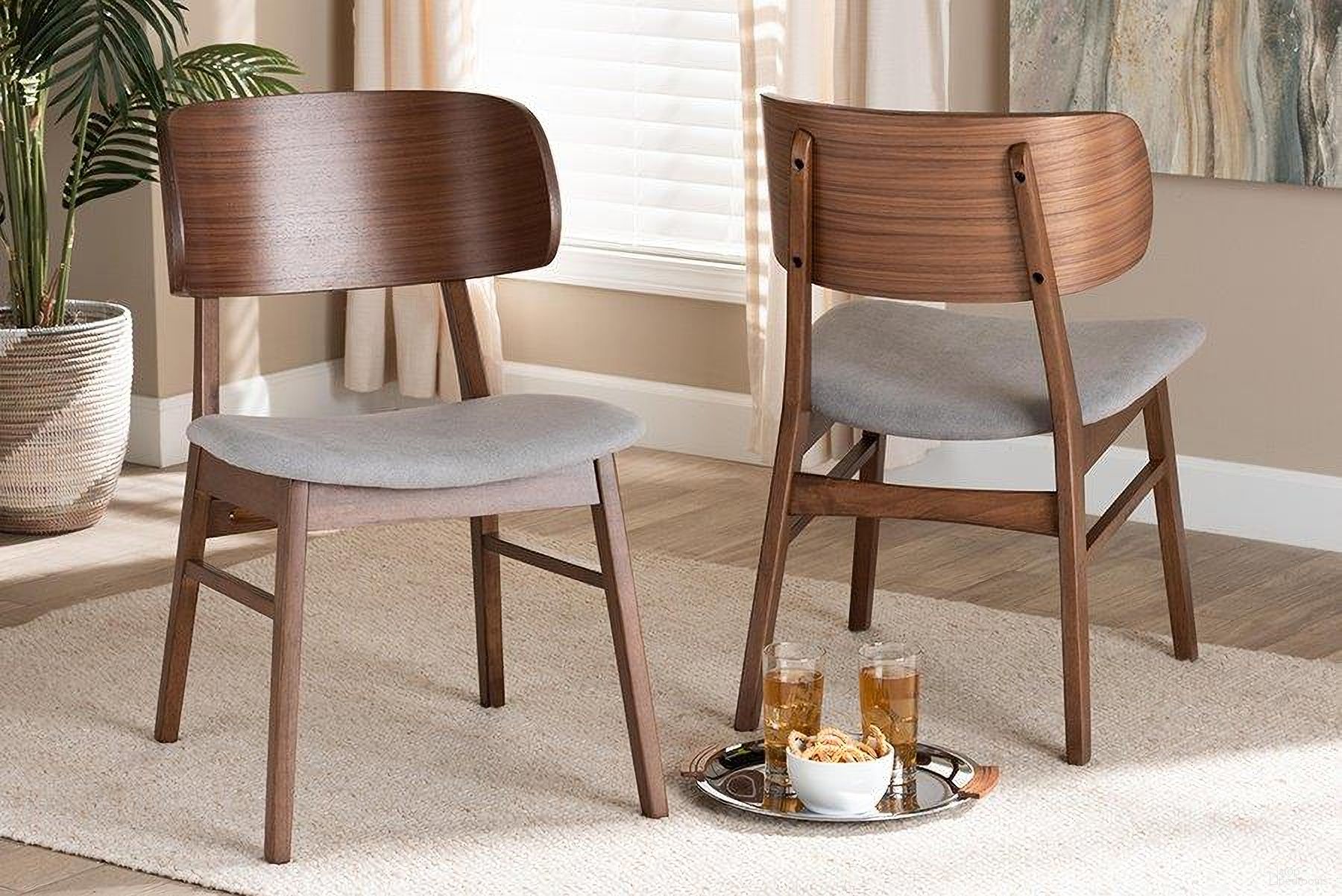 The appearance of Baxton Studio Alston Mid-Century Modern Grey Fabric Upholstered and Walnut Brown Finished Wood 2-Piece Dining Chair Set designed by Baxton Studio in the transitional interior design. This walnut and grey piece of furniture  was selected by 1StopBedrooms from Alston Collection to add a touch of cosiness and style into your home. Sku: WM1892B-Smoke/Walnut-DC. Material: Rubberwood. Chair Type: Side Chair.