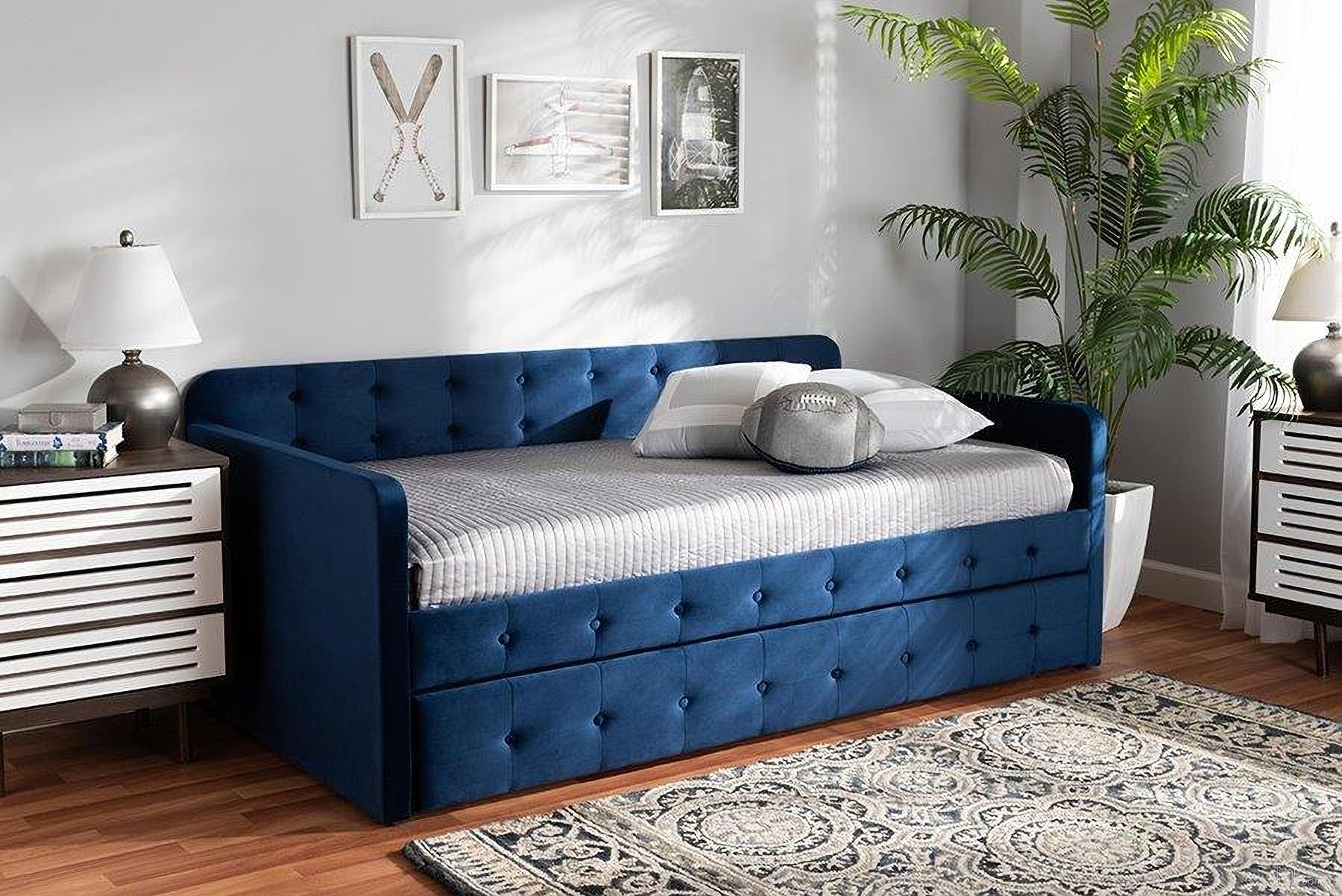 The appearance of Baxton Studio Jona Modern and Contemporary Transitional Navy Blue Velvet Fabric Upholstered and Button Tufted Twin Size Daybed with Trundle designed by Baxton Studio in the transitional interior design. This navy blue piece of furniture  was selected by 1StopBedrooms from Jona Collection to add a touch of cosiness and style into your home. Sku: CF9183-Navy Blue-Daybed-T/T. Bed Type: Daybed. Bed Size: Twin. Material: Velvet.