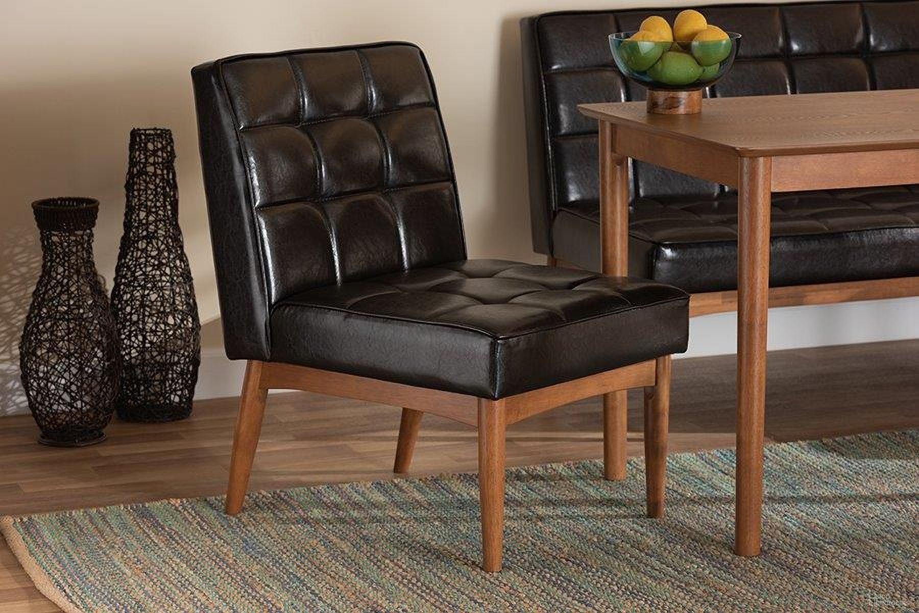 The appearance of Baxton Studio Sanford Mid-Century Modern Dark Brown Faux Leather Upholstered and Walnut Brown Finished Wood Dining Chair designed by Baxton Studio in the transitional interior design. This dark brown piece of furniture was selected by 1StopBedrooms from Sanford Collection to add a touch of cosiness and style into your home. Sku: BBT8051.11-Dark Brown/Walnut-CC. Material: MDF. Chair Type: Side Chair.