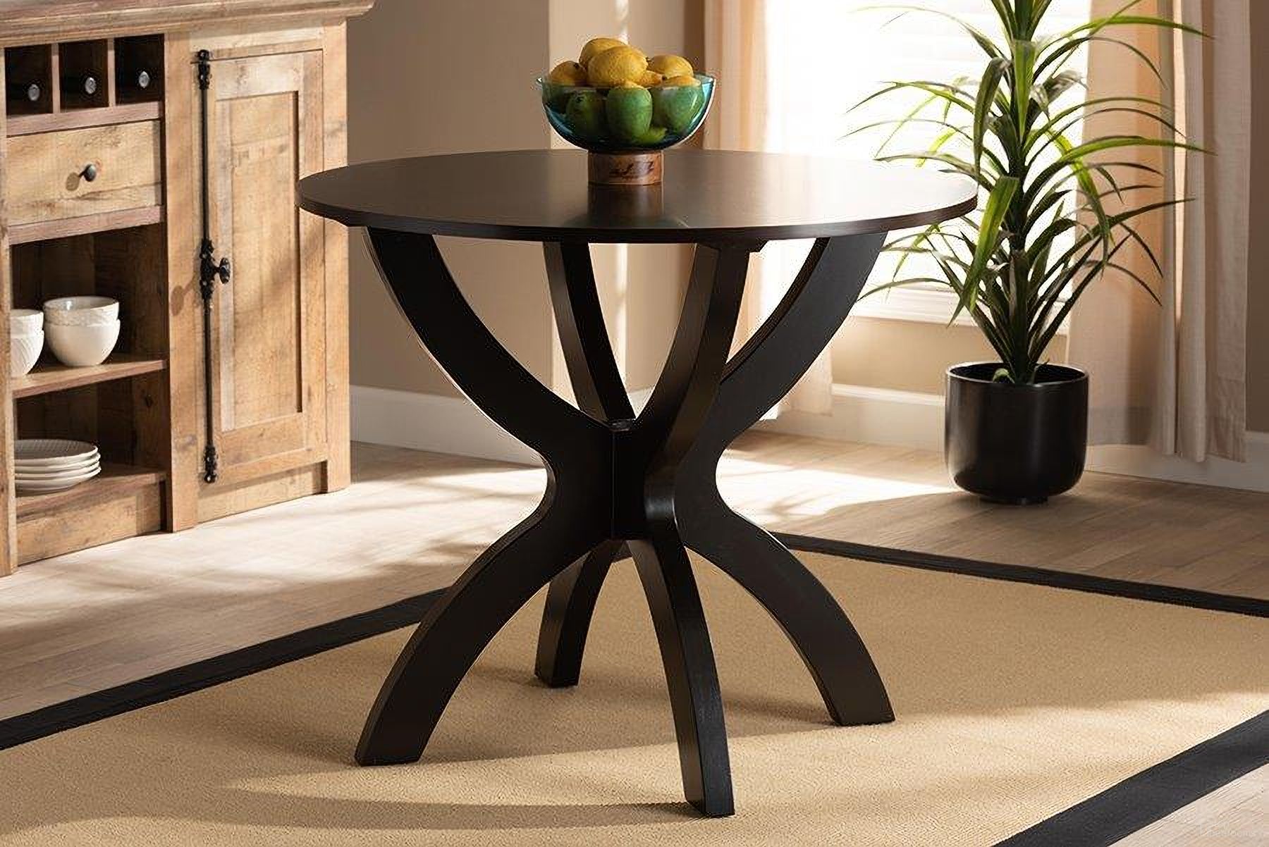 The appearance of Baxton Studio Tilde Modern and Contemporary Dark Brown Finished 35-Inch-Wide Round Wood Dining Table designed by Baxton Studio in the modern / contemporary interior design. This dark brown piece of furniture  was selected by 1StopBedrooms from Tilde Collection to add a touch of cosiness and style into your home. Sku: RH7232T-Dark Brown-35-IN-DT. Table Base Style: Pedestal. Table Top Shape: Round. Material: MDF. Size: 35".