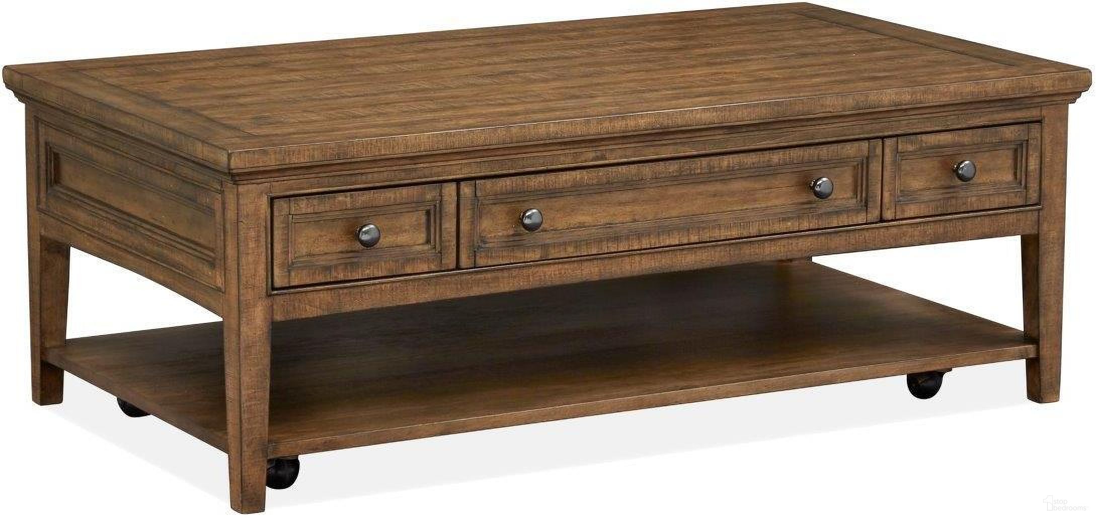 The appearance of Bay Creek Toasted Nutmeg Rectangle Castered Cocktail Table designed by Magnussen in the transitional interior design. This brown piece of furniture was selected by 1StopBedrooms from Bay Creek Collection to add a touch of cosiness and style into your home. Sku: T4398-43. Material: Pine Veneer.