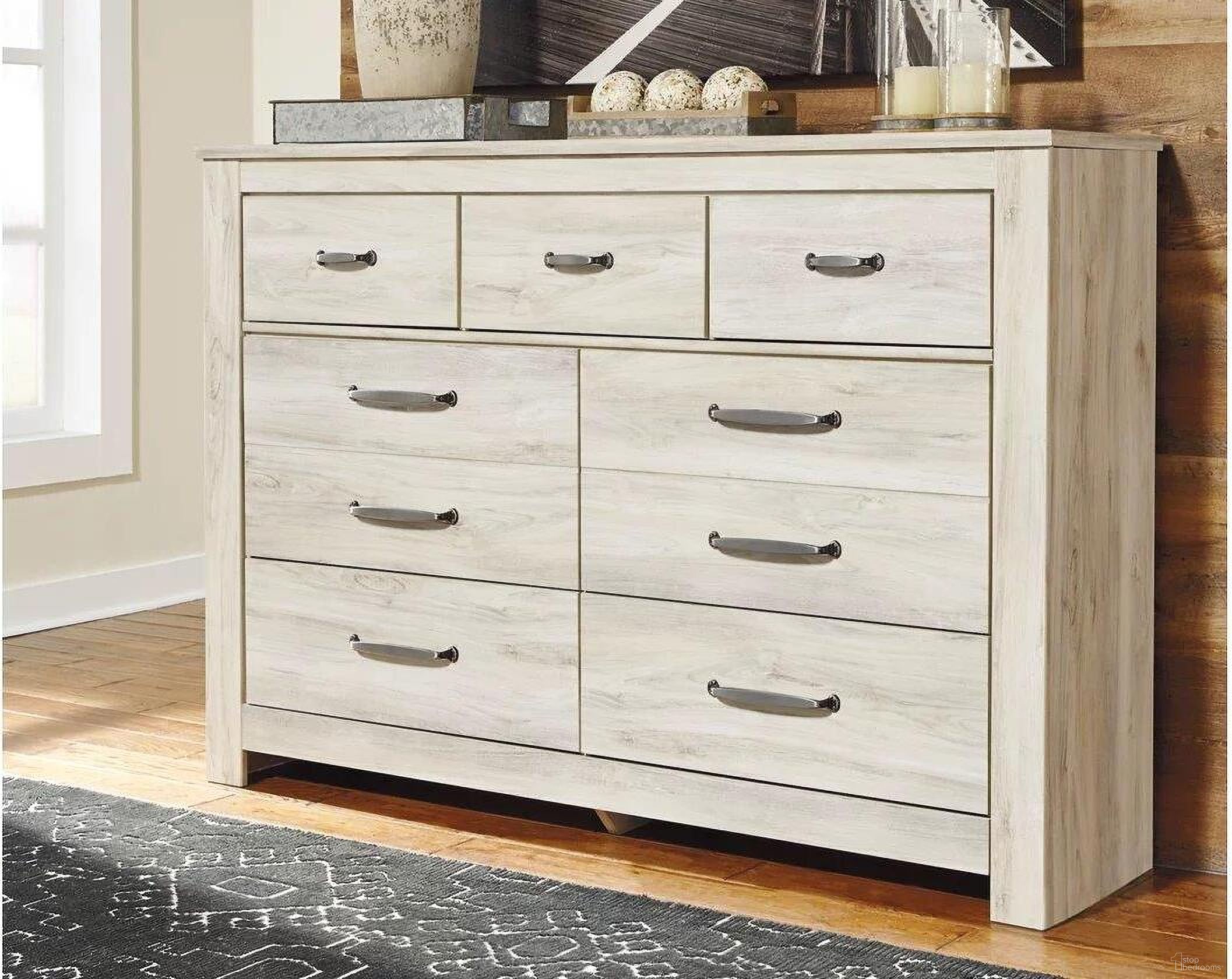 The appearance of Bellaby White Dresser designed by Signature Design by Ashley in the transitional interior design. This white wash piece of furniture was selected by 1StopBedrooms from Bellaby Collection to add a touch of cosiness and style into your home. Sku: B331-31. Material: Wood.