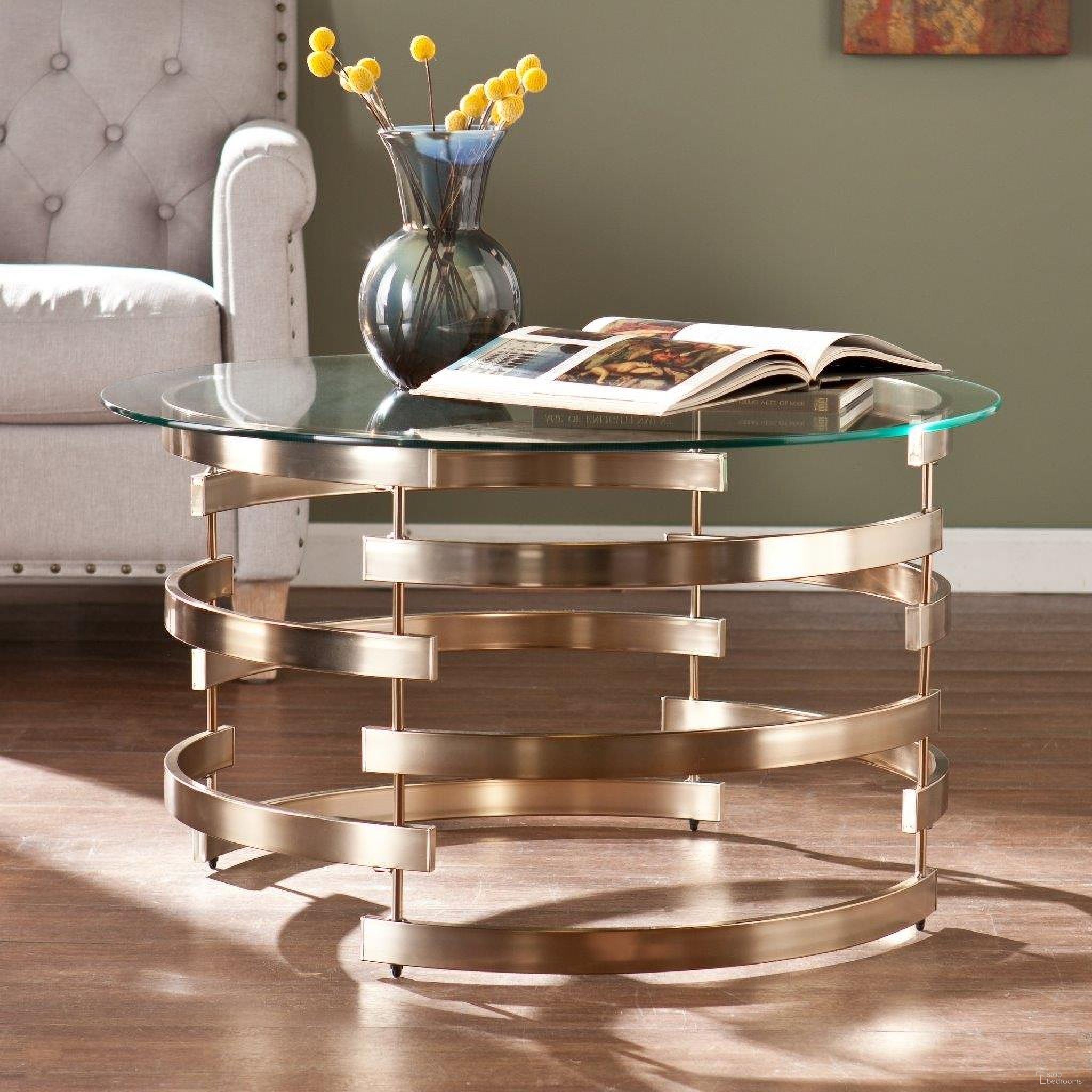 The appearance of Belmar Cocktail Table designed by SEI Furniture in the modern / contemporary interior design. This champagne piece of furniture  was selected by 1StopBedrooms from Belmar Collection to add a touch of cosiness and style into your home. Sku: CK5430. Material: Glass.