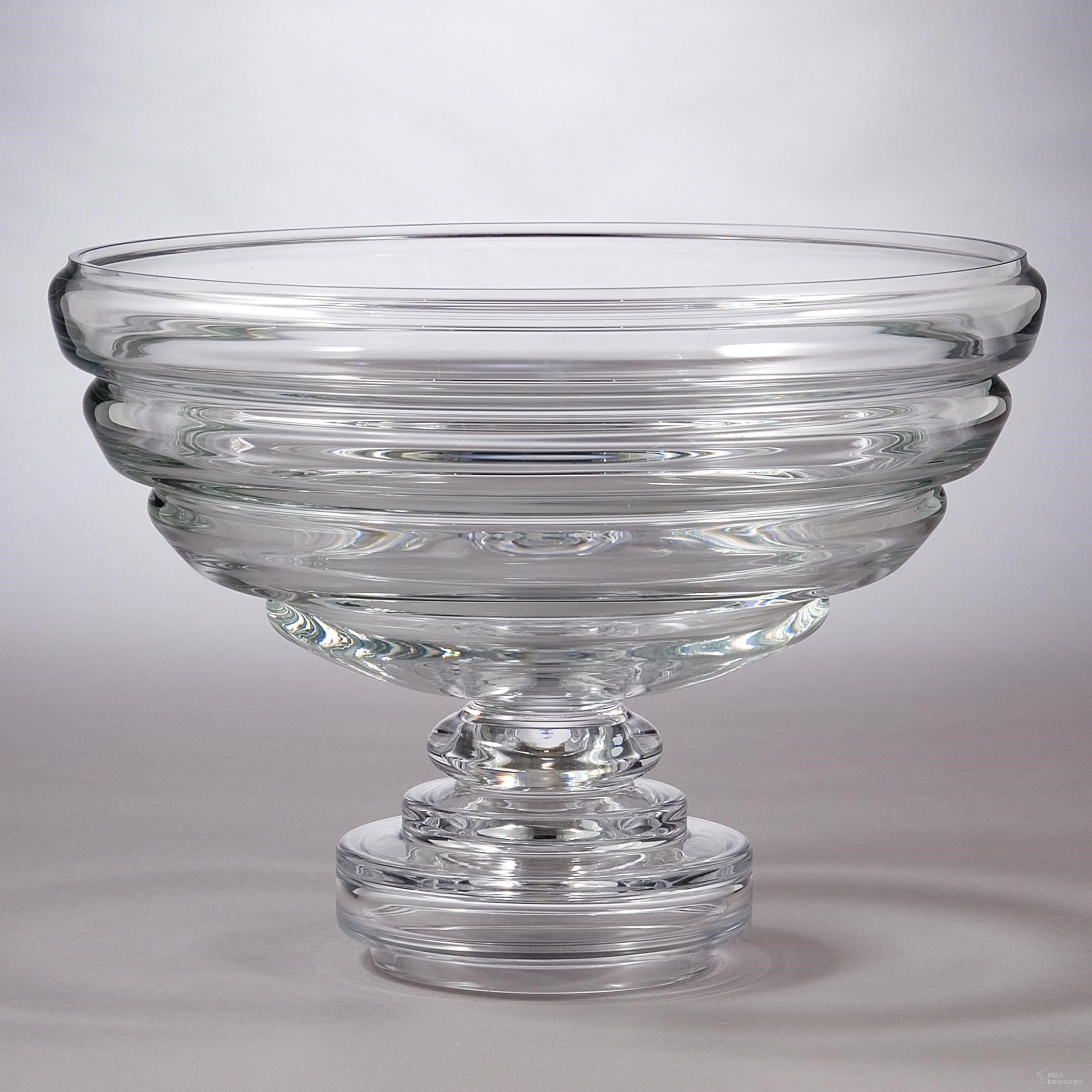 The appearance of Belted Footed Fruit Bowl In Clear designed by Global Views in the modern / contemporary interior design. This clear piece of furniture was selected by 1StopBedrooms from Belted Collection to add a touch of cosiness and style into your home. Sku: 1612. Material: Glass.