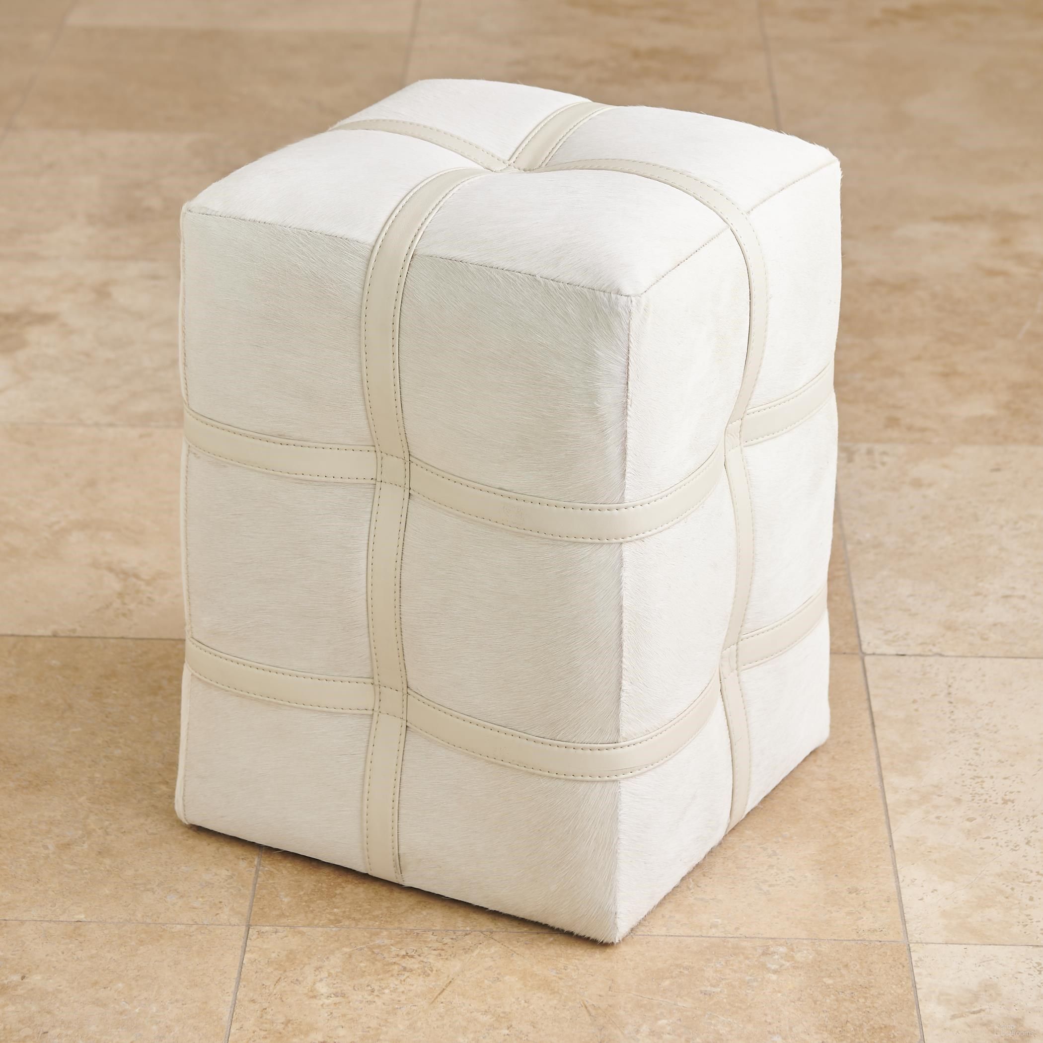 The appearance of Belted Poof In Ivory Hair On Hide Leather designed by Global Views in the modern / contemporary interior design. This ivory piece of furniture was selected by 1StopBedrooms from Belted Collection to add a touch of cosiness and style into your home. Sku: 993211. Material: Leather.