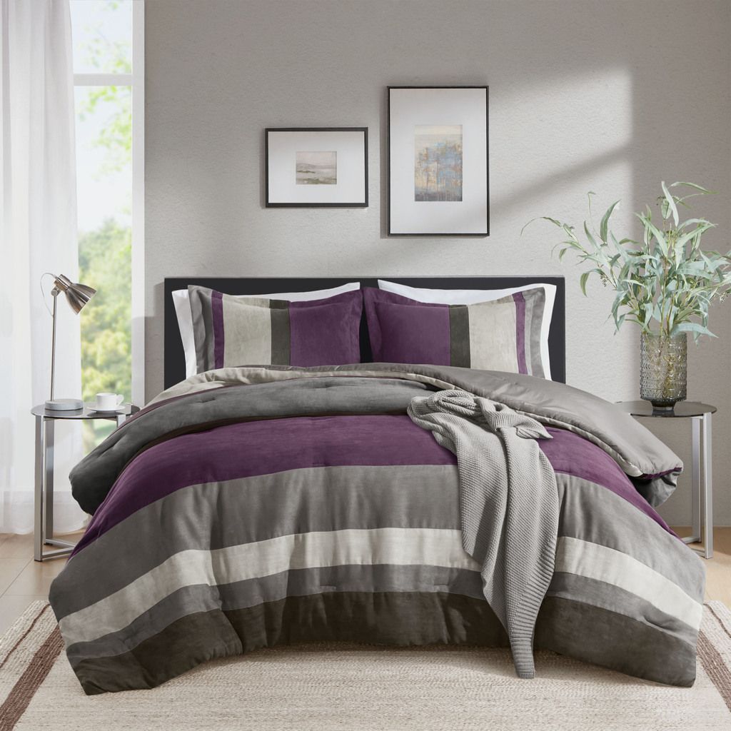 The appearance of Boulder Stripe Pieced Faux Suede Comforter Set In Purple designed by Olliix in the modern / contemporary interior design. This purple piece of furniture  was selected by 1StopBedrooms from Boulder Stripe Collection to add a touch of cosiness and style into your home. Sku: AM10-0293. Material: Polyester. Bed Size: Twin.