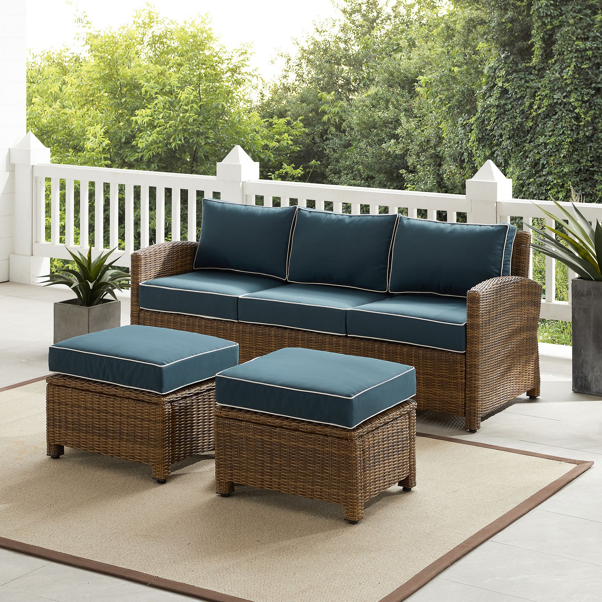 The appearance of Bradenton 3 Piece Wicker Outdoor Sofa Patio Furniture Set In Navy and Weathered Brown designed by Crosley Brands in the traditional interior design. This navy piece of furniture was selected by 1StopBedrooms from Bradenton Collection to add a touch of cosiness and style into your home. Sku: CO7131-WB-2OF2;CO7131-WB-1OF2;CO7126-WB;CO7126-WB;MO74994-NV. Material: Polyester.
