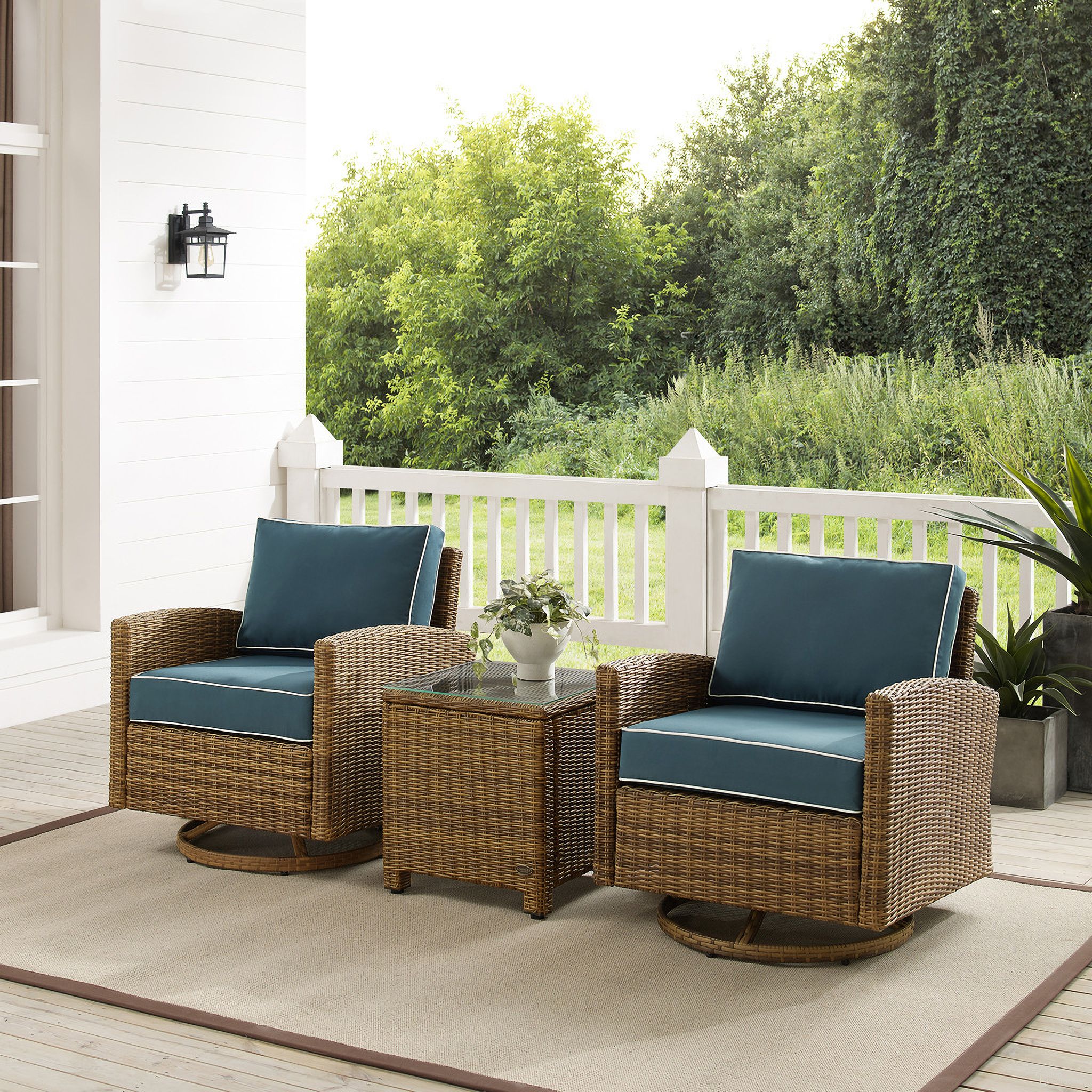 The appearance of Bradenton 3 Piece Wicker Swivel Rocker Outdoor Chair Set In Navy and Weathered Brown designed by Crosley Brands in the traditional interior design. This navy piece of furniture  was selected by 1StopBedrooms from Bradenton Collection to add a touch of cosiness and style into your home. Sku: CO7127-WB;CO7127-WB;CO7219-WB;MO7499-NV. Material: Steel.