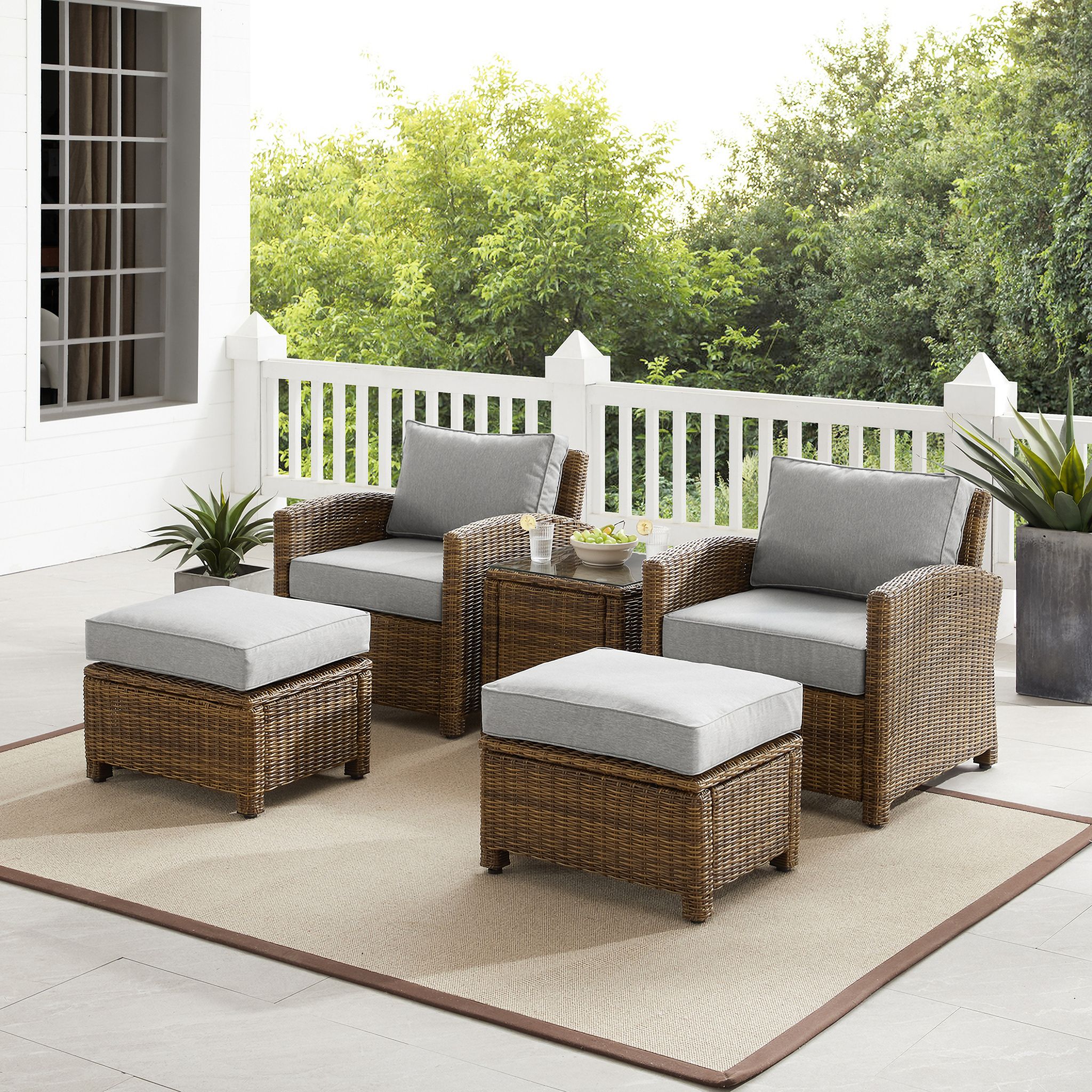 The appearance of Bradenton 5 Piece Wicker Outdoor Chair Set In Gray and Weathered Brown designed by Crosley Brands in the traditional interior design. This gray piece of furniture was selected by 1StopBedrooms from Bradenton Collection to add a touch of cosiness and style into your home. Sku: CO7116-WB;CO7116-WB;CO7126-WB;CO7126-WB;CO7219-WB;MO74992-GY. Material: Polyester.