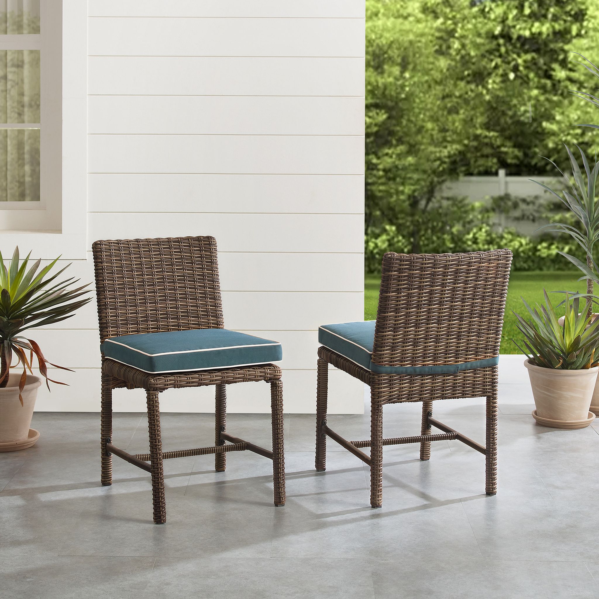 The appearance of Bradenton Wicker Outdoor Dining Chair Set of 2 In Navy and Weathered Brown designed by Crosley Brands in the traditional interior design. This navy piece of furniture was selected by 1StopBedrooms from Bradenton Collection to add a touch of cosiness and style into your home. Sku: CO7242-WB;CO7424-NV. Material: Polyester.