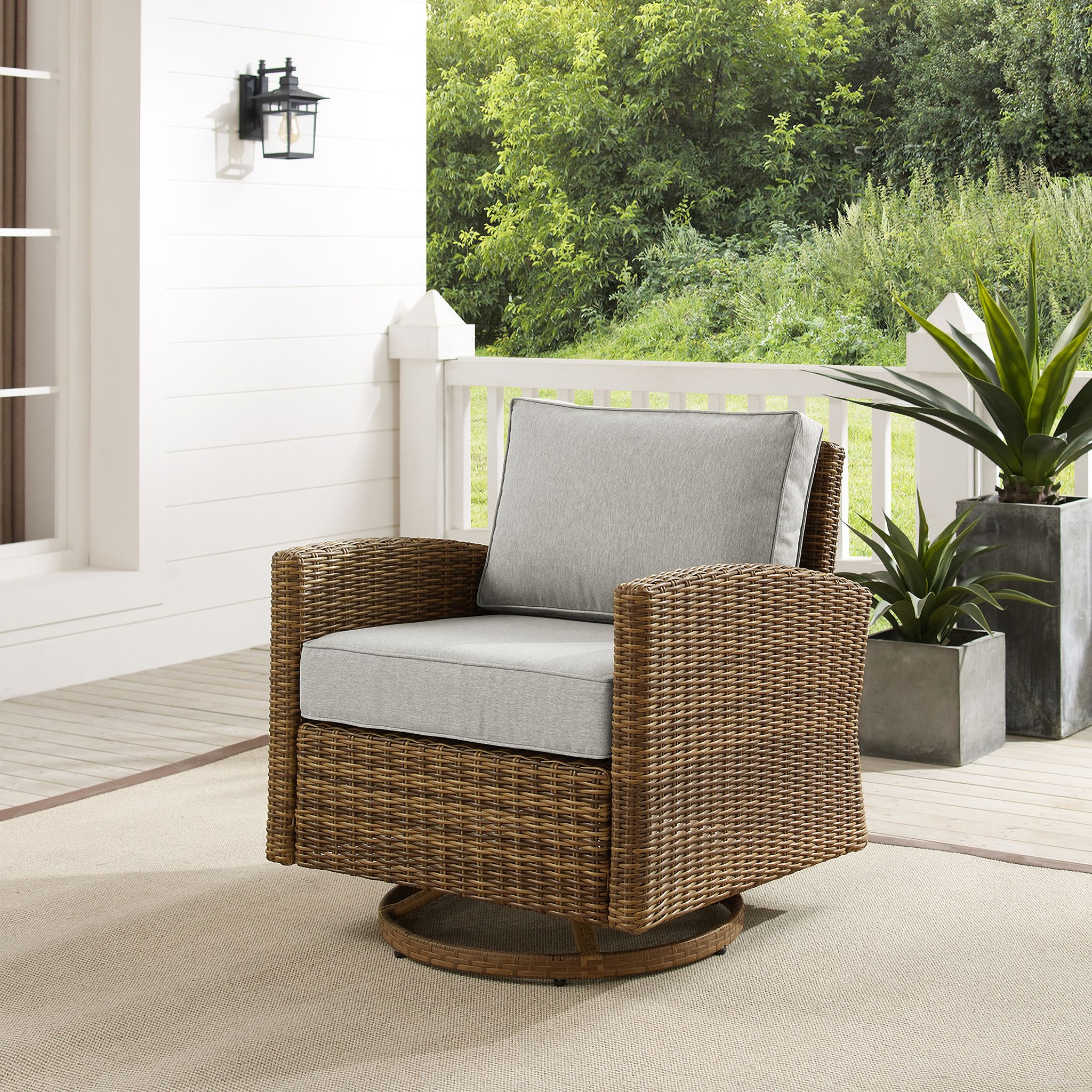 The appearance of Bradenton Wicker Swivel Rocker Outdoor Chair In Gray and Weathered Brown designed by Crosley Brands in the traditional interior design. This gray piece of furniture was selected by 1StopBedrooms from Bradenton Collection to add a touch of cosiness and style into your home. Sku: CO7127-WB;CO7401-GY. Material: Polyester.