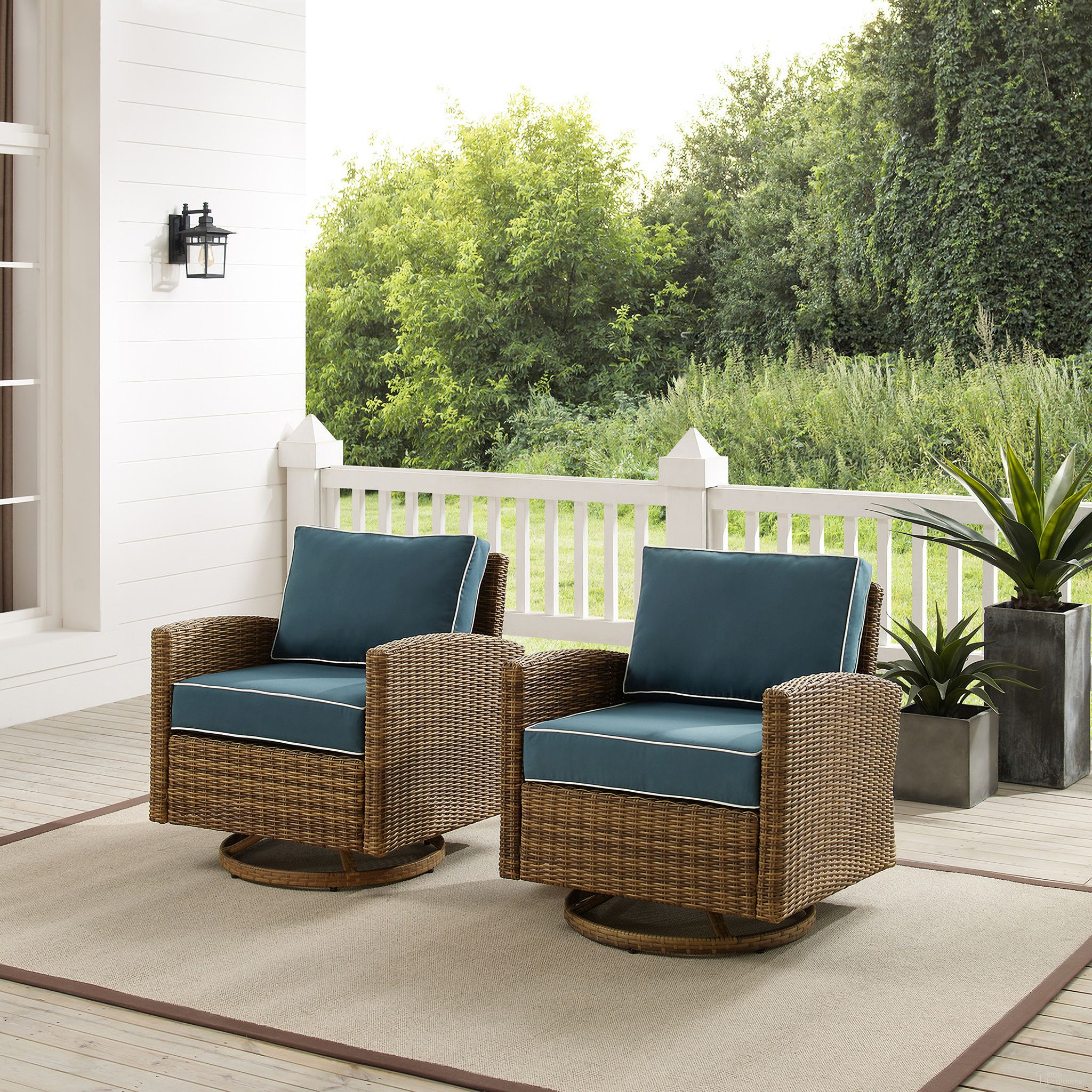 The appearance of Bradenton Wicker Swivel Rocker Outdoor Chair In Navy and Weathered Brown - Set of 2 designed by Crosley Brands in the traditional interior design. This navy piece of furniture  was selected by 1StopBedrooms from Bradenton Collection to add a touch of cosiness and style into your home. Sku: CO7127-WB;CO7127-WB;MO7499-NV. Material: Polyester.