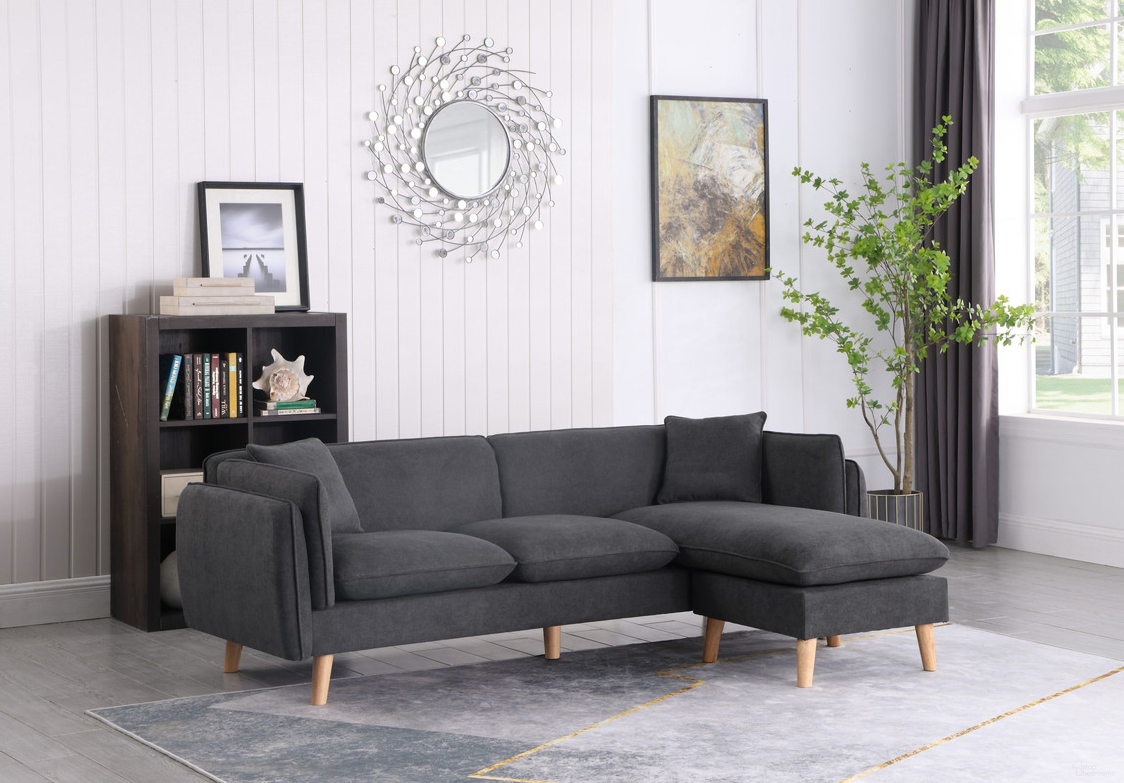 The appearance of Brayden Dark Gray Fabric Sectional Sofa Chaise designed by Lilola Home in the modern / contemporary interior design. This dark gray piece of furniture was selected by 1StopBedrooms from Brayden Collection to add a touch of cosiness and style into your home. Sku: 89640. Material: Wood. Layout: Sofa & Chaise.