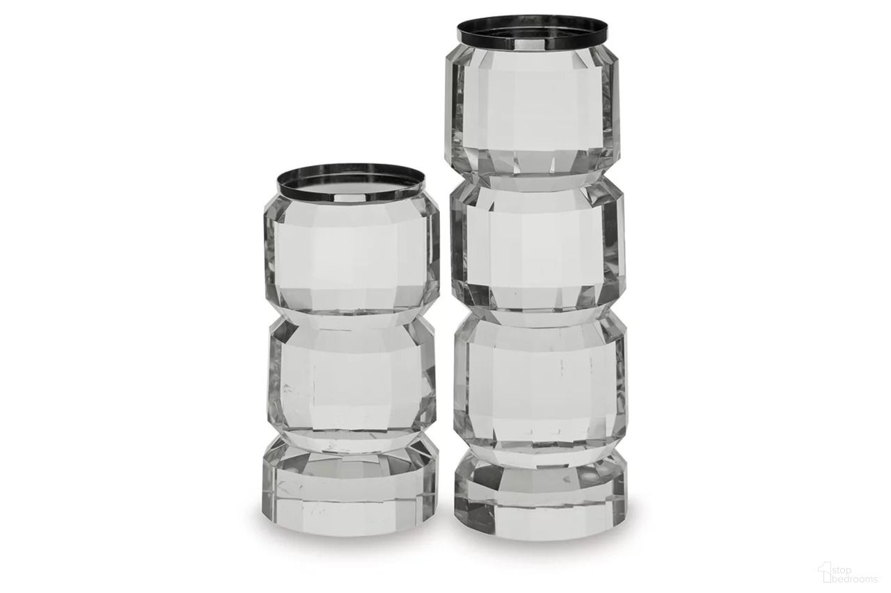 The appearance of Brentley 2 Piece Candle Holder Set In Clear/Silver designed by Signature Design by Ashley in the modern / contemporary interior design. This clear/silver piece of furniture was selected by 1StopBedrooms from Brentley Collection to add a touch of cosiness and style into your home. Sku: A2000770. Material: Glass.