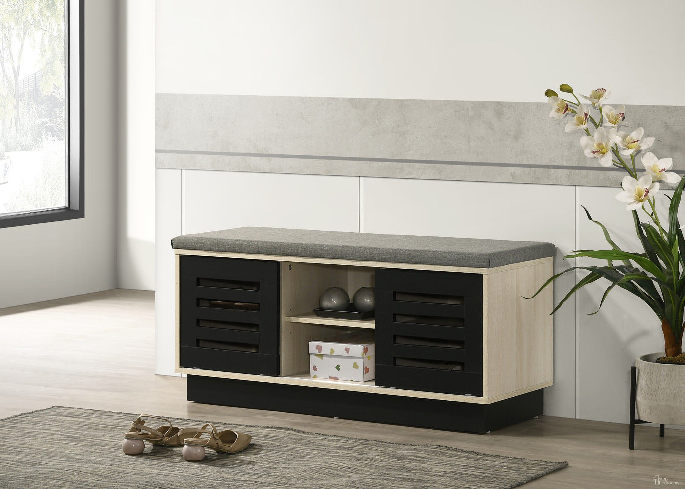 The appearance of Brett 38.5 Inch Shoe Cabinet with Sliding Doors and Upholstered Top In Oak designed by Lilola Home in the modern / contemporary interior design. This oak piece of furniture  was selected by 1StopBedrooms from Brett Collection to add a touch of cosiness and style into your home. Sku: 97020. Material: Wood.