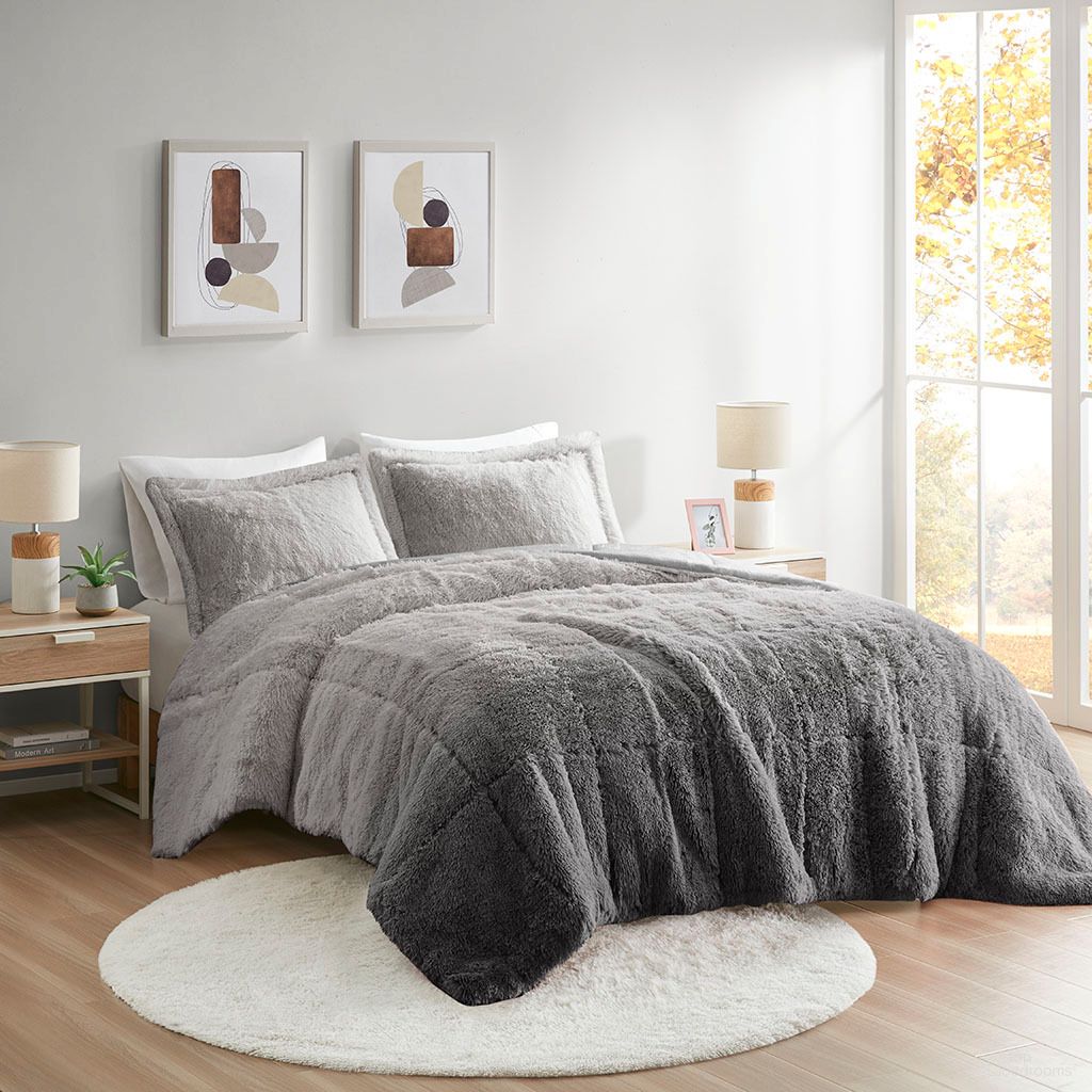 The appearance of Brielle Ombre Shaggy Long Fur 3 Piece King/Cal King Comforter Mini Set In Grey designed by Olliix in the transitional interior design. This grey piece of furniture was selected by 1StopBedrooms from Brielle Collection to add a touch of cosiness and style into your home. Sku: ID10-2148. Material: Polyester. Bed Size: King.