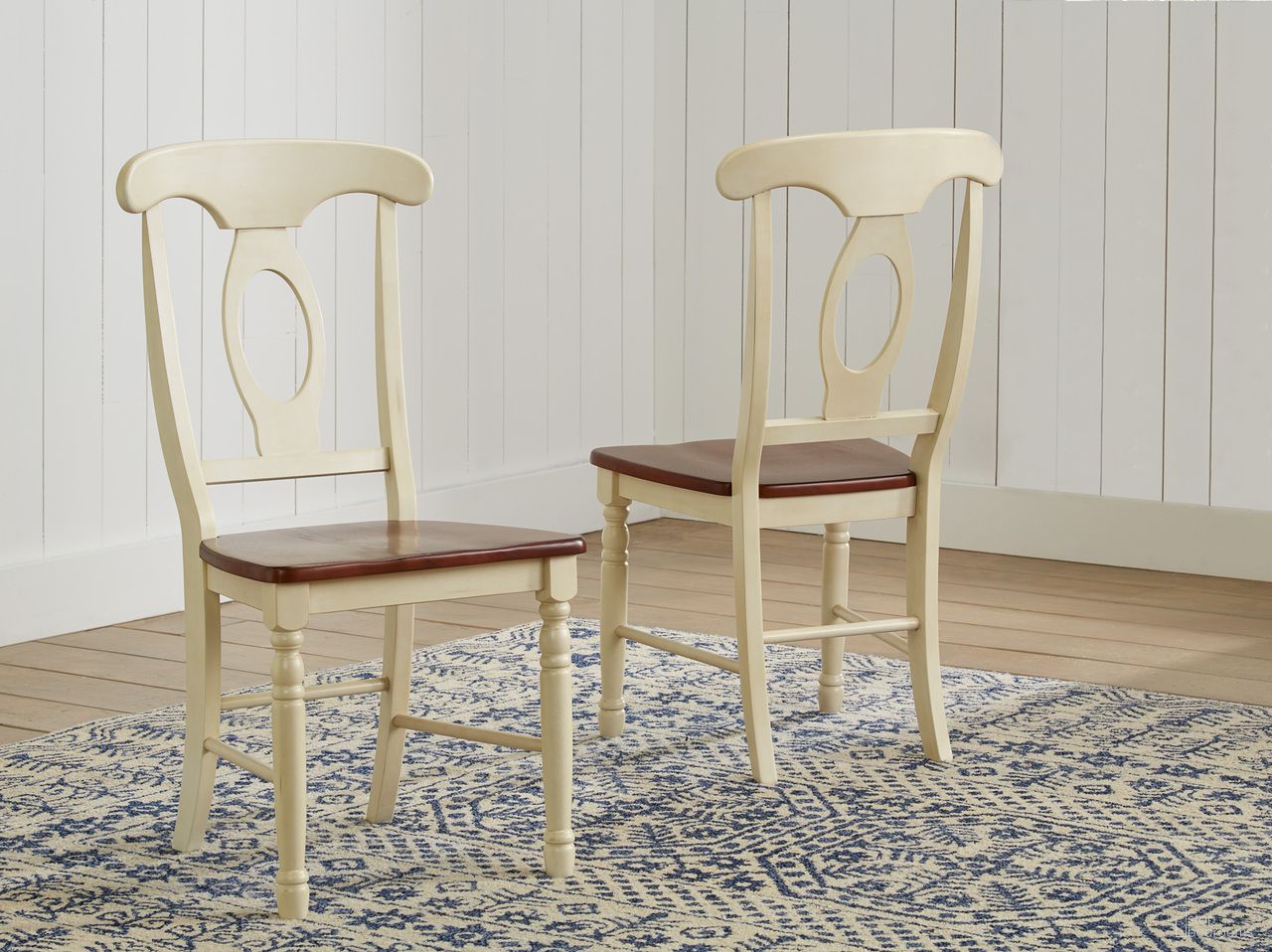 The appearance of British Isles Merlot Buttermilk Napoleon Side Chair Set of 2 designed by A-America in the transitional interior design. This merlot piece of furniture was selected by 1StopBedrooms from British Isles Collection to add a touch of cosiness and style into your home. Sku: BRIMB2852. Material: Rubberwood. Chair Type: Side Chair.
