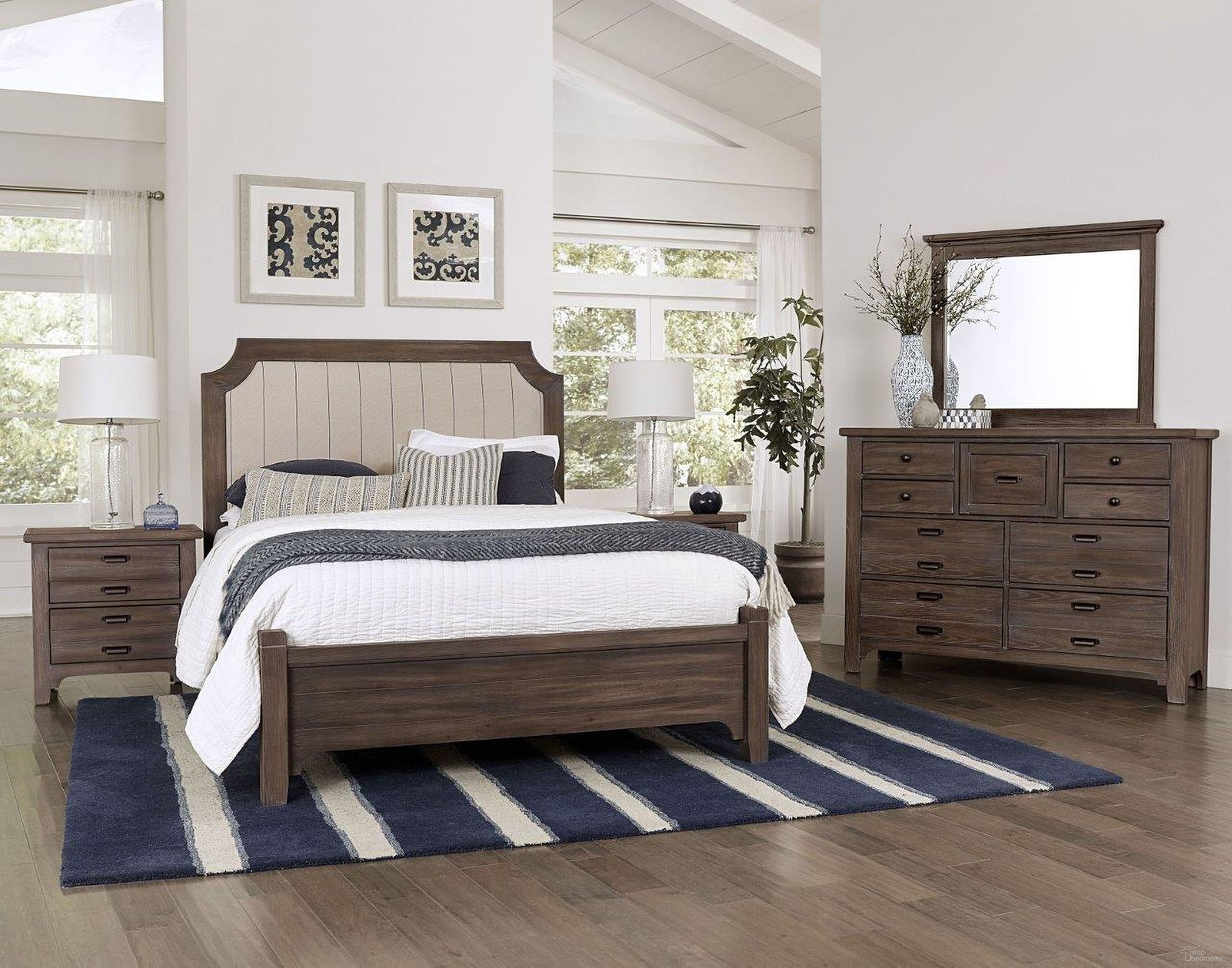 The appearance of Bungalow Folkstone Upholstered Panel Bedroom Set designed by Vaughan Bassett in the transitional interior design. This brown piece of furniture was selected by 1StopBedrooms from Bungalow Collection to add a touch of cosiness and style into your home. Sku: 740-551-855-922;740-226. Material: Fabric. Bed Size: Queen. Bed Type: Upholstered Bed.
