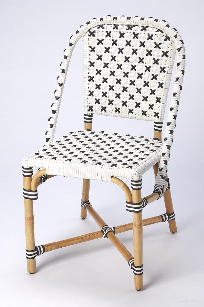 The appearance of Butler Tenor White and Black Rattan Dining Chair 5398295 designed by Butler Specialty Company in the transitional interior design. This white and black piece of furniture was selected by 1StopBedrooms from Designer's Edge Collection to add a touch of cosiness and style into your home. Sku: 5398295. Material: Rattan. Chair Type: Side Chair.