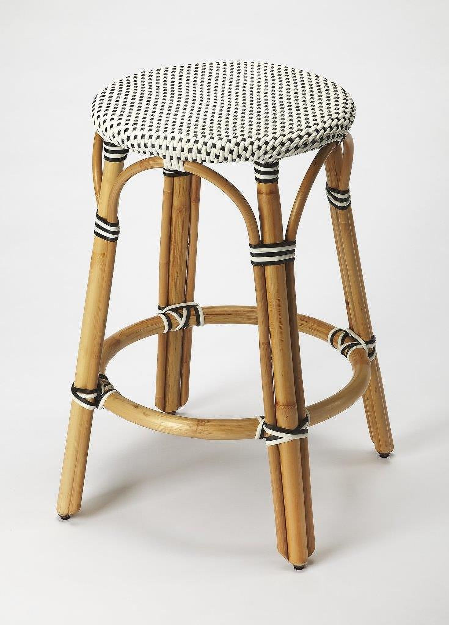 The appearance of Butler Tobias Black and White Rattan Counter Stool 9371295 designed by Butler Specialty Company in the transitional interior design. This black piece of furniture  was selected by 1StopBedrooms from Designer's Edge Collection to add a touch of cosiness and style into your home. Sku: 9371295. Material: Rattan.
