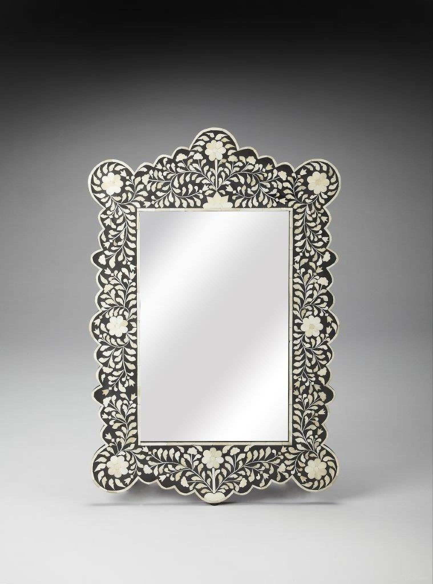 The appearance of Butler Vivienne Arched Bone Inlay Wall Mirror designed by Butler Specialty Company in the traditional interior design. This black piece of furniture  was selected by 1StopBedrooms from Bone Inlay Collection to add a touch of cosiness and style into your home. Sku: 3482318. Material: Wood.
