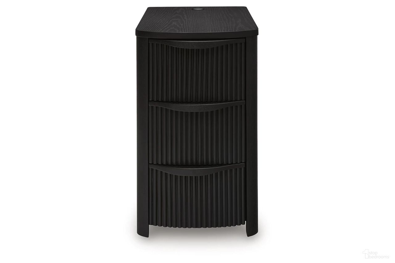 The appearance of Camdill Chairside End Table In Black designed by Signature Design by Ashley in the transitional interior design. This black piece of furniture  was selected by 1StopBedrooms from Camdill Collection to add a touch of cosiness and style into your home. Sku: T208-117. Material: Wood.