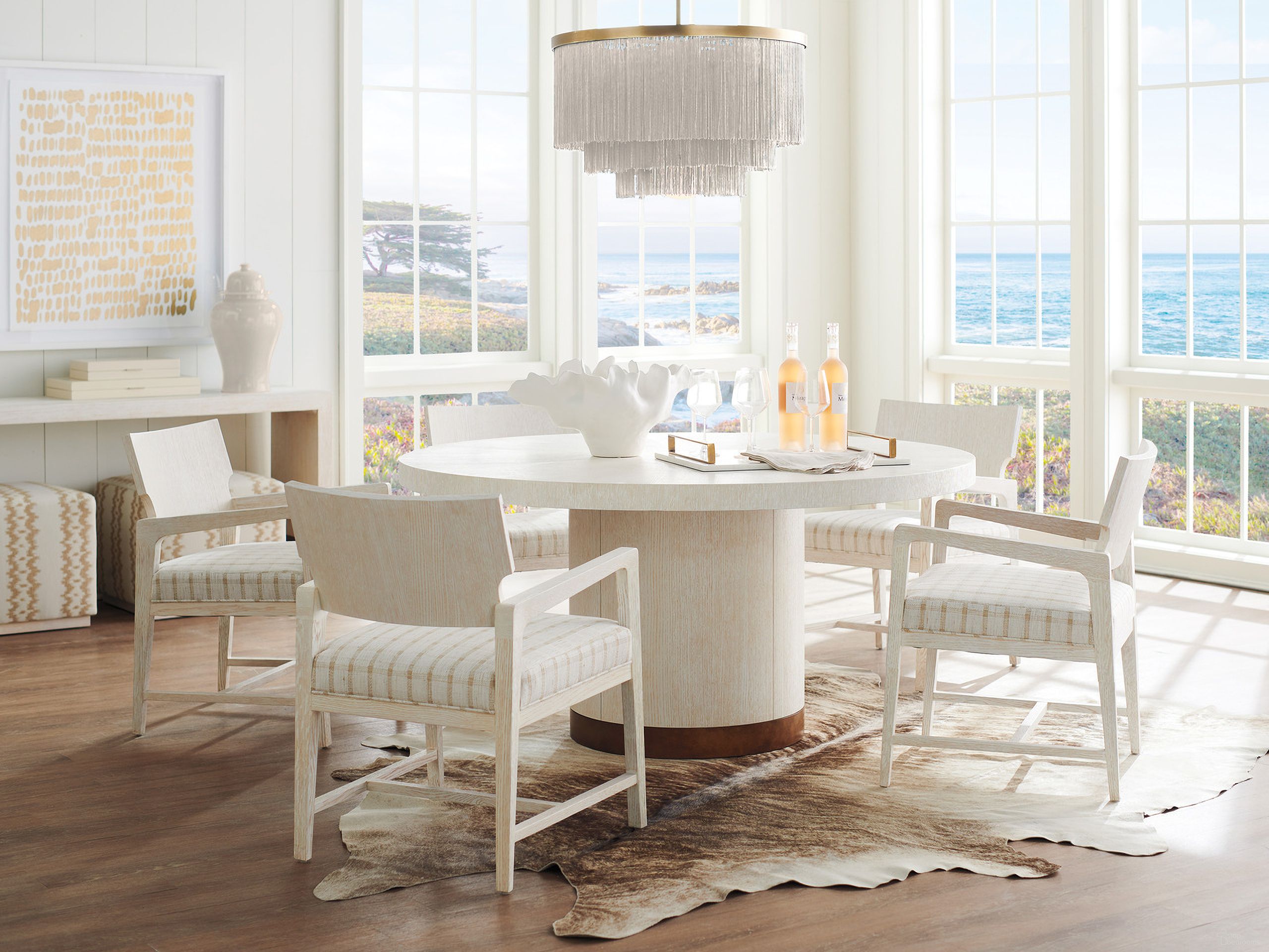 The appearance of Carmel Selfridge Round Dining Room Set In Monterey designed by Barclay Butera in the transitional interior design. This monterey piece of furniture was selected by 1StopBedrooms from Carmel Collection to add a touch of cosiness and style into your home. Sku: 931-875C;931-881-40. Table Top Shape: Round. Material: Metal. Size: 60".