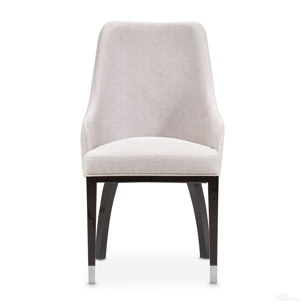 The appearance of Carmela Dining Arm Chair Set of 2 In Glossy Charcoal Sand designed by Michael Amini in the transitional interior design. This charcoal sand piece of furniture was selected by 1StopBedrooms from Carmela Collection to add a touch of cosiness and style into your home. Sku: LFR-CRMA004A-830. Chair Type: Arm Chair. Material: Solid Wood.
