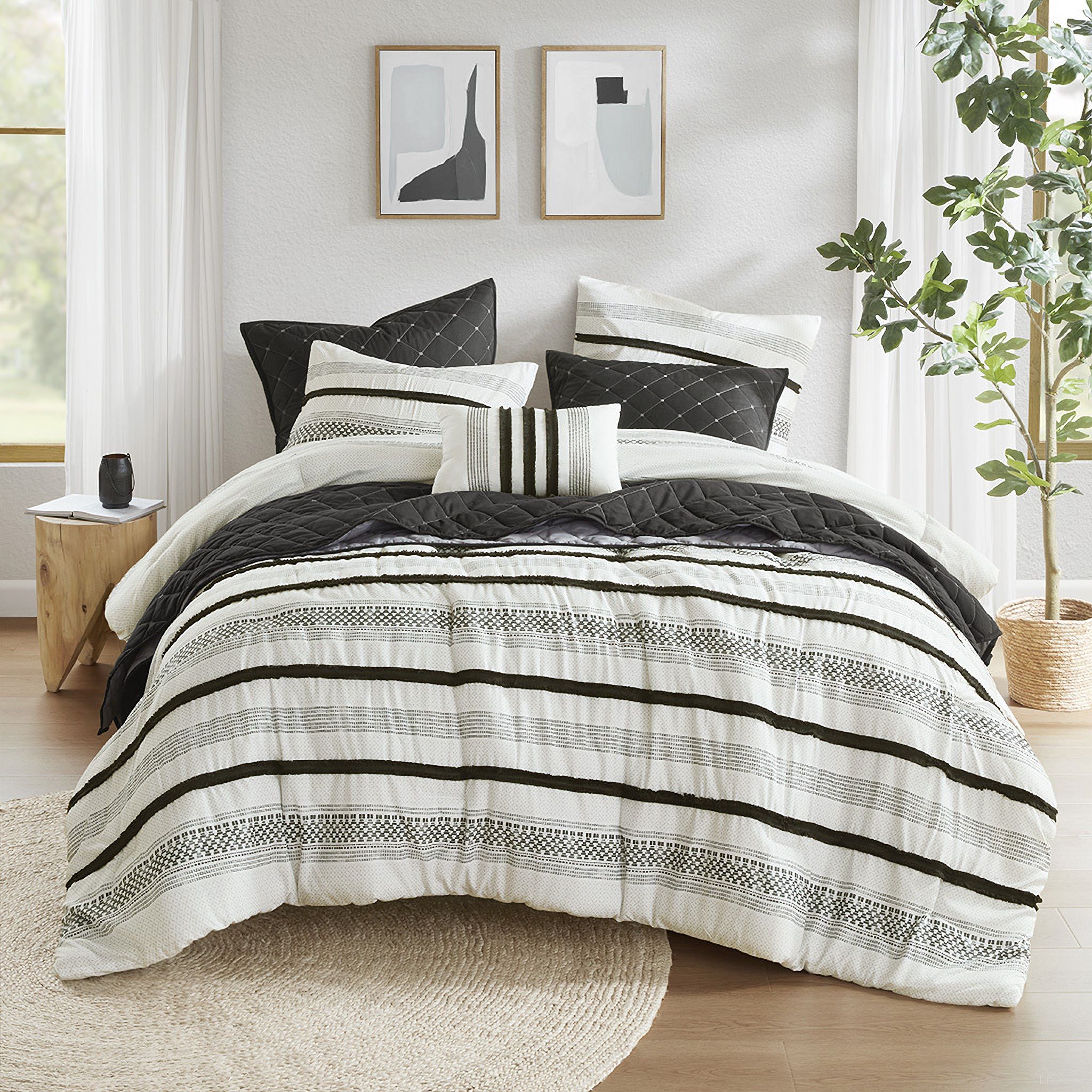 The appearance of Carolina 7 Piece Stripe Comforter and Quilt Set In Black designed by Olliix in the modern / contemporary interior design. This black piece of furniture  was selected by 1StopBedrooms from Carolina Collection to add a touch of cosiness and style into your home. Sku: MP10-8487. Material: Polyester. Bed Size: King.