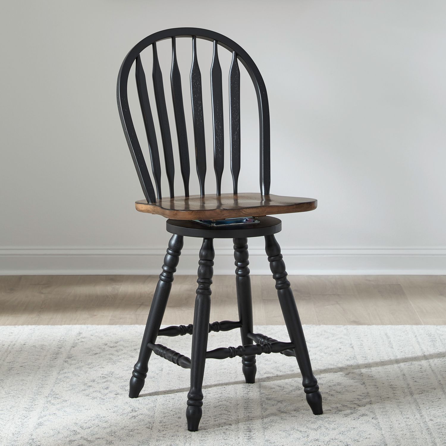 The appearance of Carolina Crossing Windsor Swivel Counter Chair Set of 2 In Black And Antique Honey designed by Liberty in the country / farmhouse interior design. This black and antique honey piece of furniture  was selected by 1StopBedrooms from Carolina Crossing Collection to add a touch of cosiness and style into your home. Sku: 186B-B100324. Material: Solid Rubberwood.