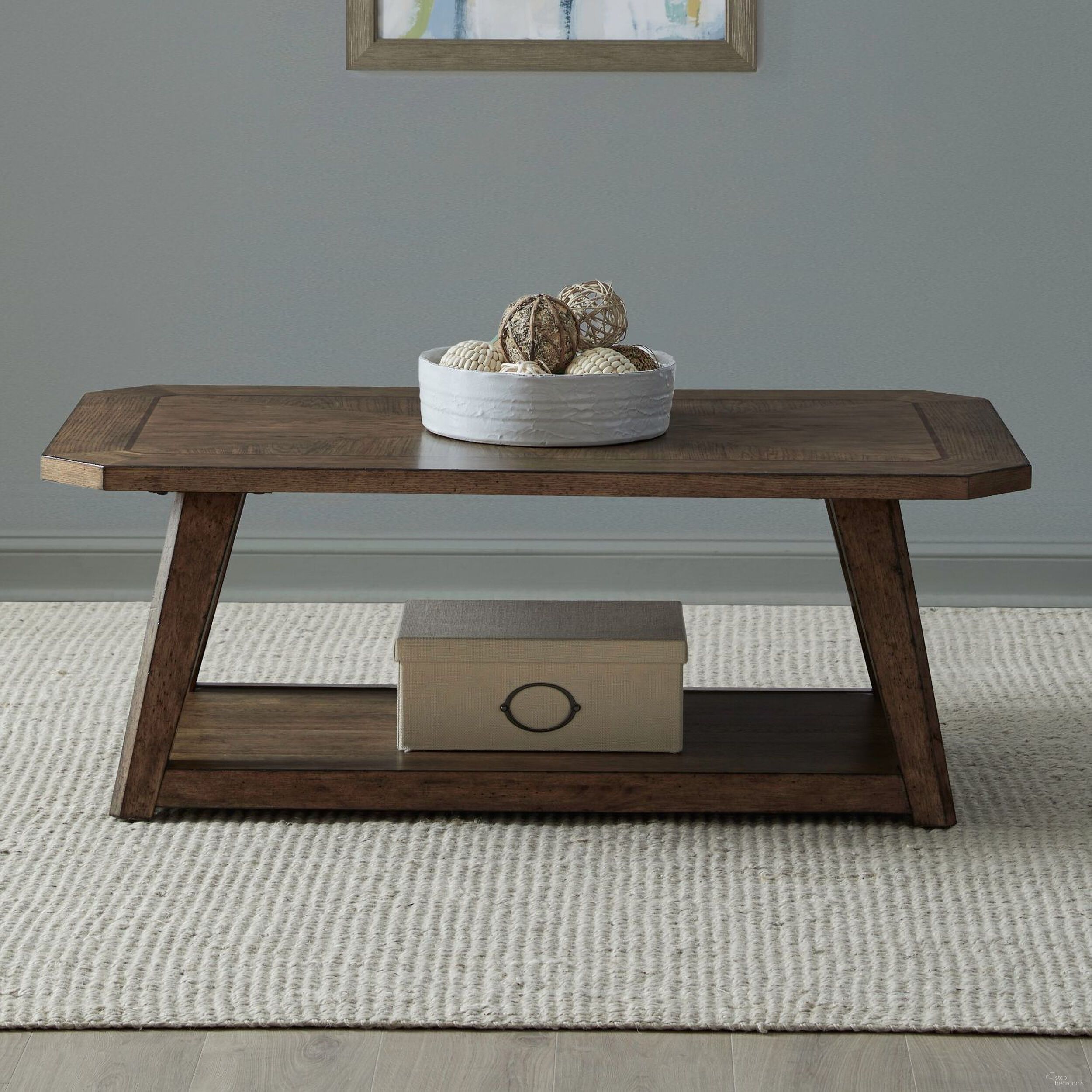 The appearance of Carolina Park Rectangular Cocktail Table In Amber Brown designed by Liberty in the transitional interior design. This amber brown piece of furniture was selected by 1StopBedrooms from Carolina Park Collection to add a touch of cosiness and style into your home. Sku: 930-OT1011. Material: Solid Rubberwood.