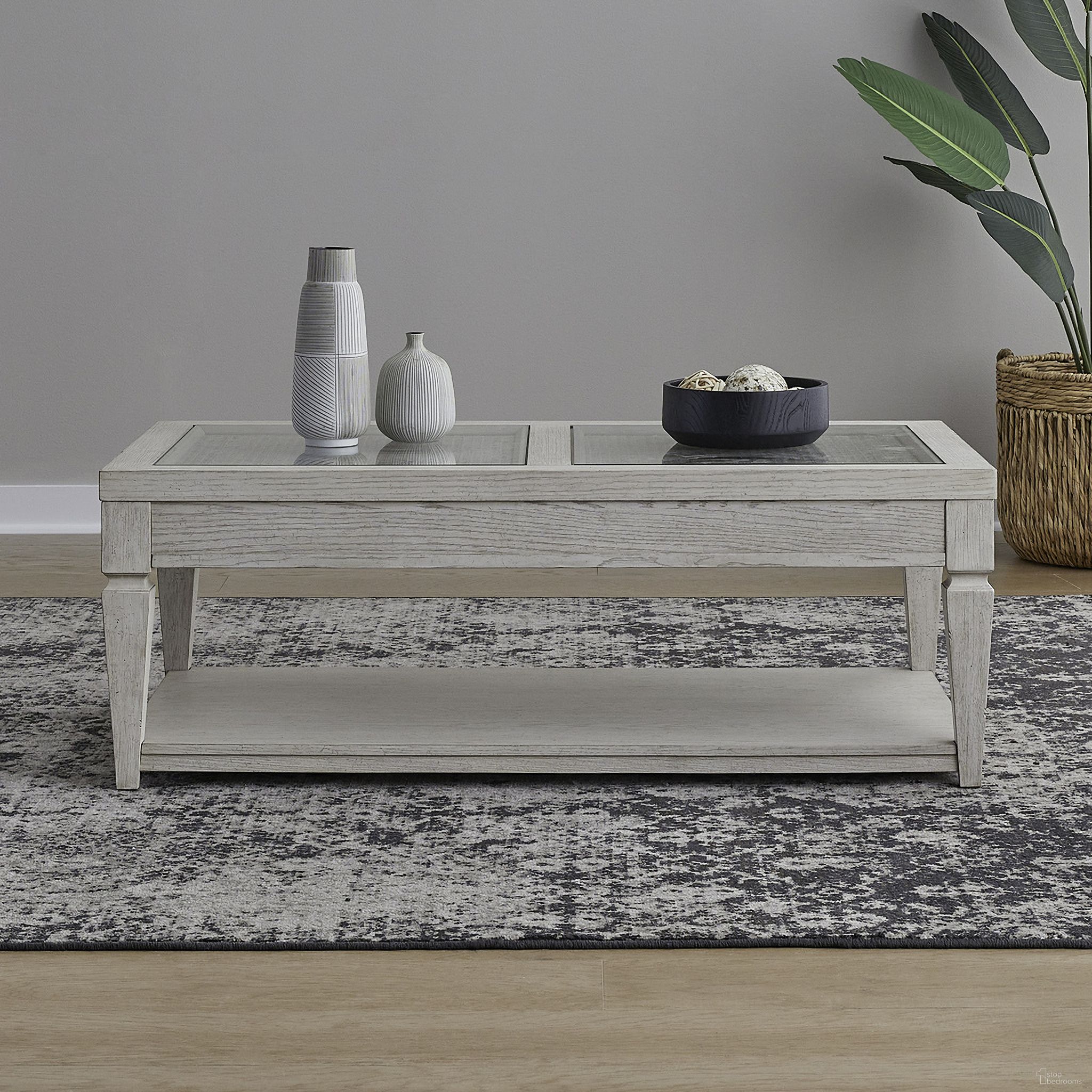 The appearance of Caruso Heights Cocktail Table In White designed by Liberty in the transitional interior design. This white piece of furniture  was selected by 1StopBedrooms from Caruso Heights Collection to add a touch of cosiness and style into your home. Sku: 271W-OT1010. Material: Solid Rubberwood.