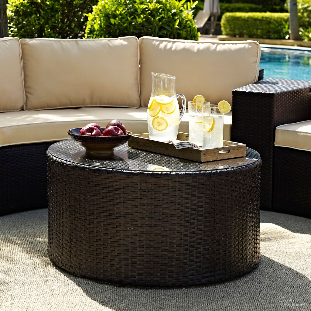 The appearance of Catalina Wicker Outdoor Round Coffee Table In Brown designed by Crosley Brands in the modern / contemporary interior design. This brown piece of furniture  was selected by 1StopBedrooms from Catalina Collection to add a touch of cosiness and style into your home. Sku: CO7121-BR. Material: Steel.