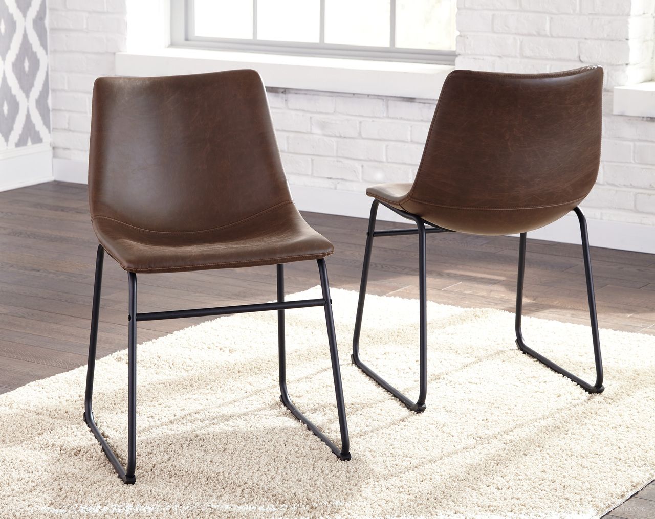 The appearance of Centiar Brown and Black Dining Upholstered Side Chair Set of 2 designed by Signature Design by Ashley in the transitional interior design. This brown piece of furniture was selected by 1StopBedrooms from Centiar Collection to add a touch of cosiness and style into your home. Sku: D372-01. Material: Leather Match. Chair Type: Side Chair.