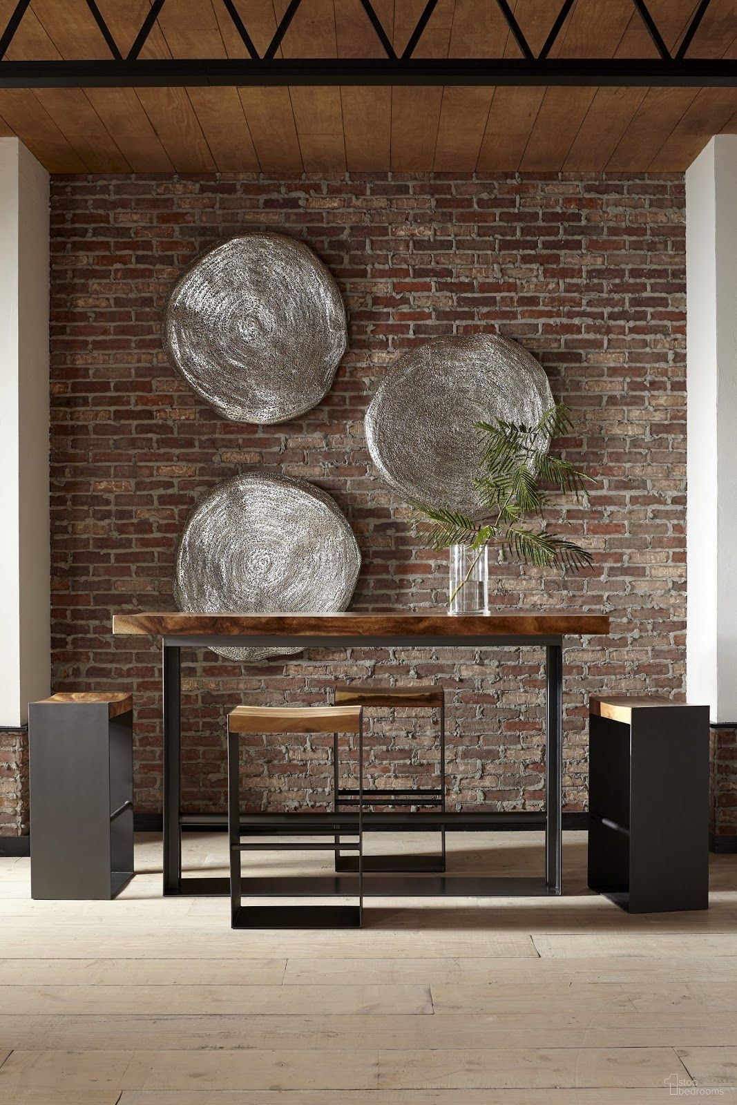The appearance of Chamcha Natural Brown and Black Iron Frame Bar Table Set designed by Phillips Collection in the modern / contemporary interior design. This black and brown piece of furniture  was selected by 1StopBedrooms from Chamcha Collection to add a touch of cosiness and style into your home. Sku: TH81409;TH81407. Material: Wood.