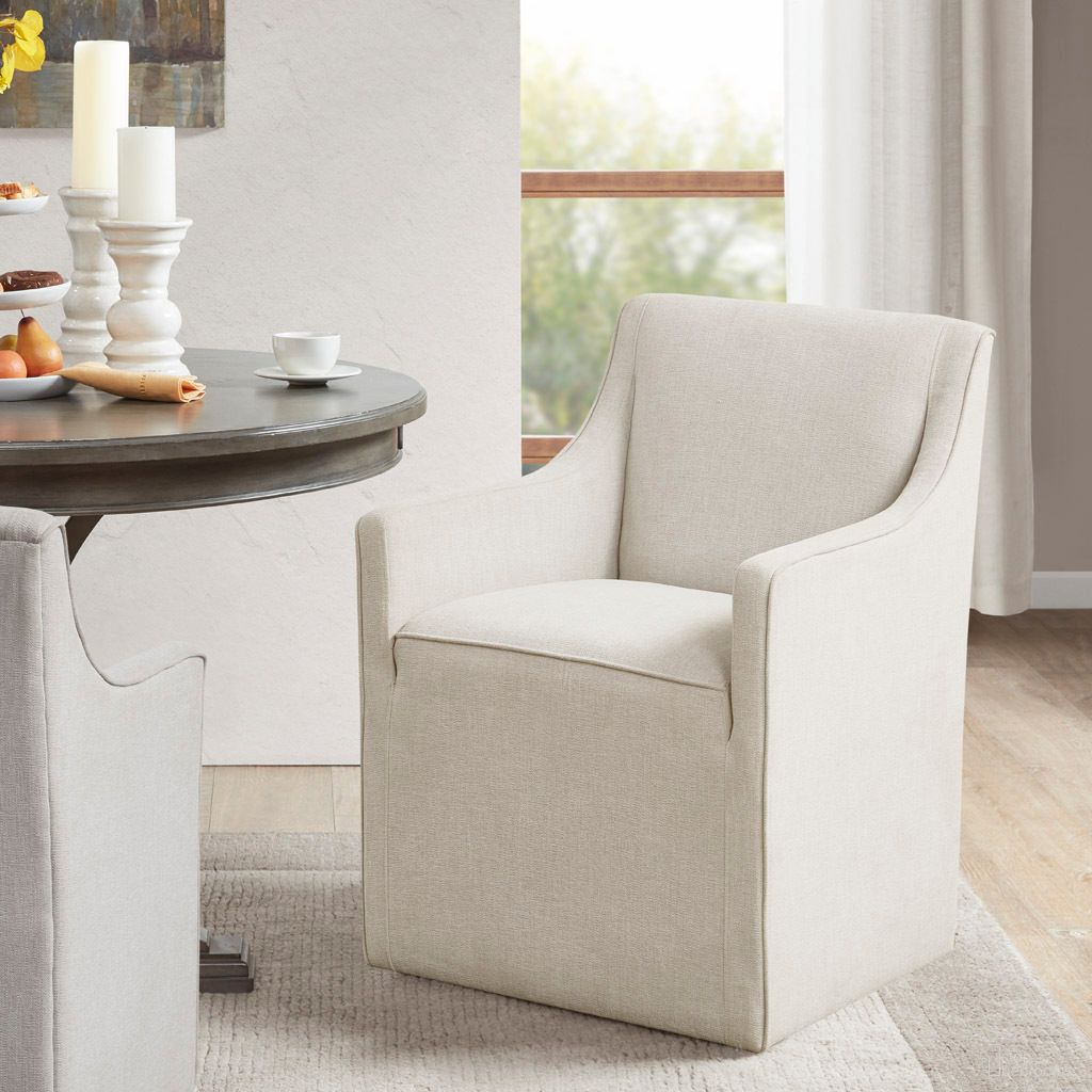 The appearance of Charlotte Skirted Dining Arm Chair with Casters In Cream designed by Olliix in the transitional interior design. This cream piece of furniture was selected by 1StopBedrooms from Charlotte Collection to add a touch of cosiness and style into your home. Sku: MP108-1243. Material: Polyester. Chair Type: Arm Chair.