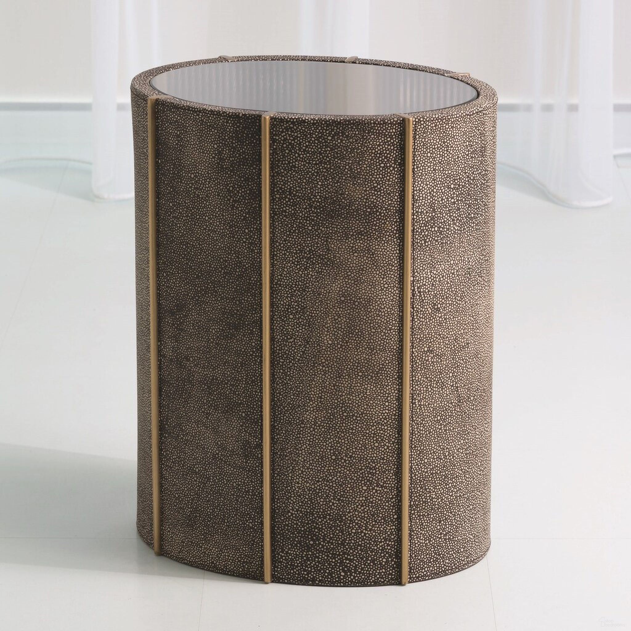 The appearance of Churchill Oval Drum Table In Gold designed by Global Views in the modern / contemporary interior design. This gold piece of furniture  was selected by 1StopBedrooms from Churchill Collection to add a touch of cosiness and style into your home. Sku: 790325. Material: Leather.