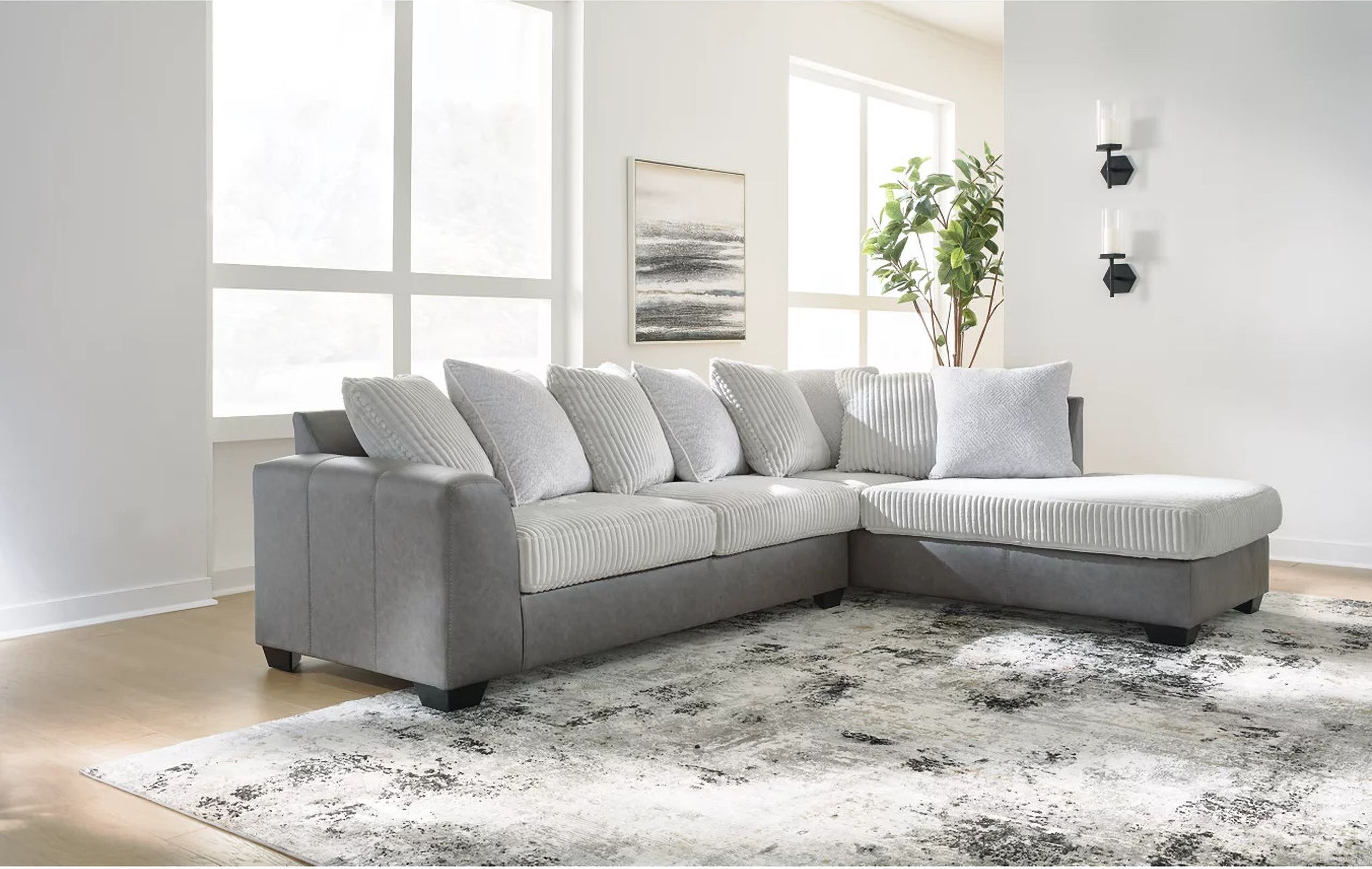 The appearance of Clairette Court 2-Piece Sectional With RAF Chaise In Alloy designed by Signature Design by Ashley in the modern / contemporary interior design. This alloy piece of furniture was selected by 1StopBedrooms from Clairette Court Collection to add a touch of cosiness and style into your home. Sku: 3150366;3150317. Material: Leather. Layout: RAF.