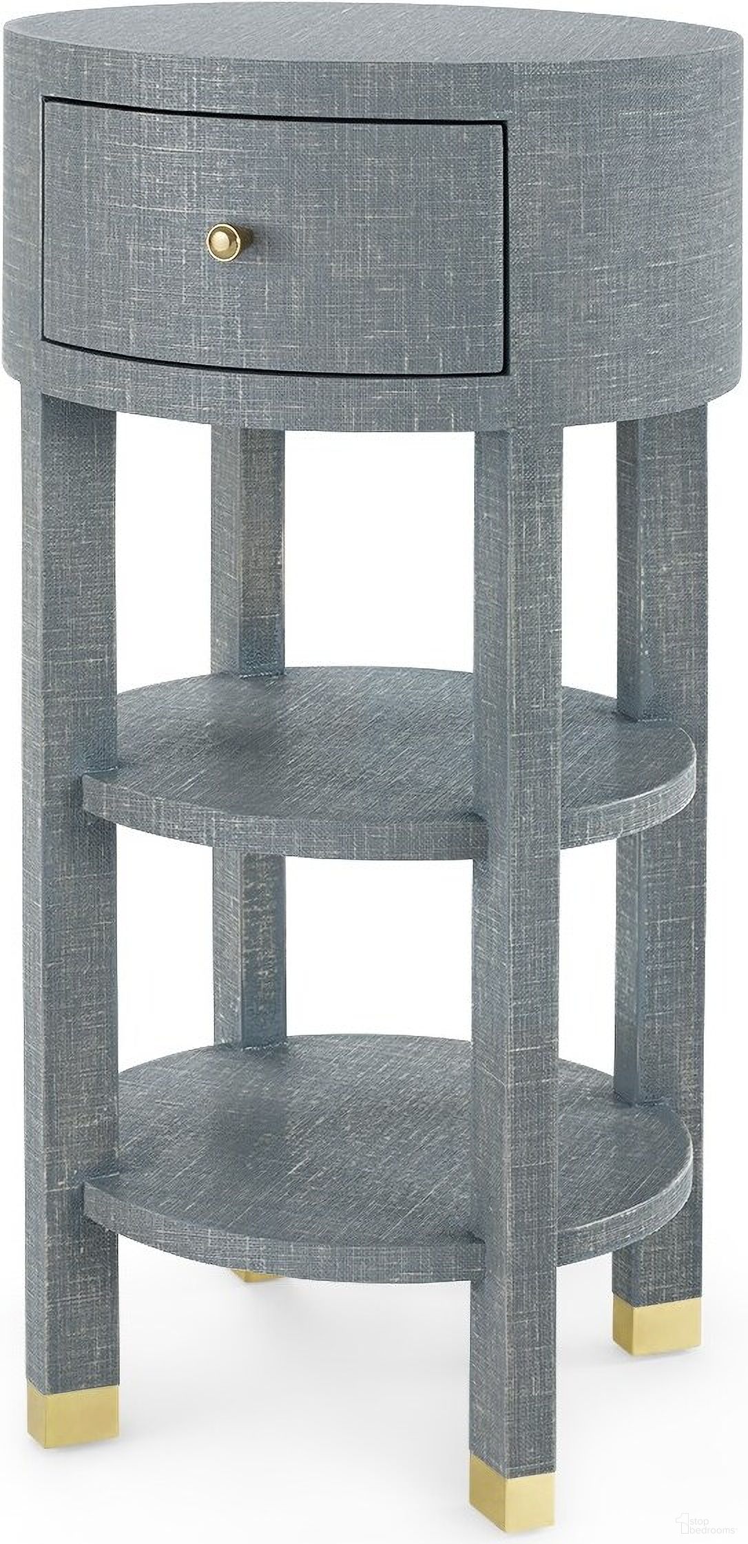 The appearance of Claudette 1-Drawer Round Side Table with Brass Legs In Washed Winter Gray designed by Villa & House in the transitional interior design. This washed grey piece of furniture was selected by 1StopBedrooms from Claudette Collection to add a touch of cosiness and style into your home. Sku: CLU-115-5126-803. Material: Linen.