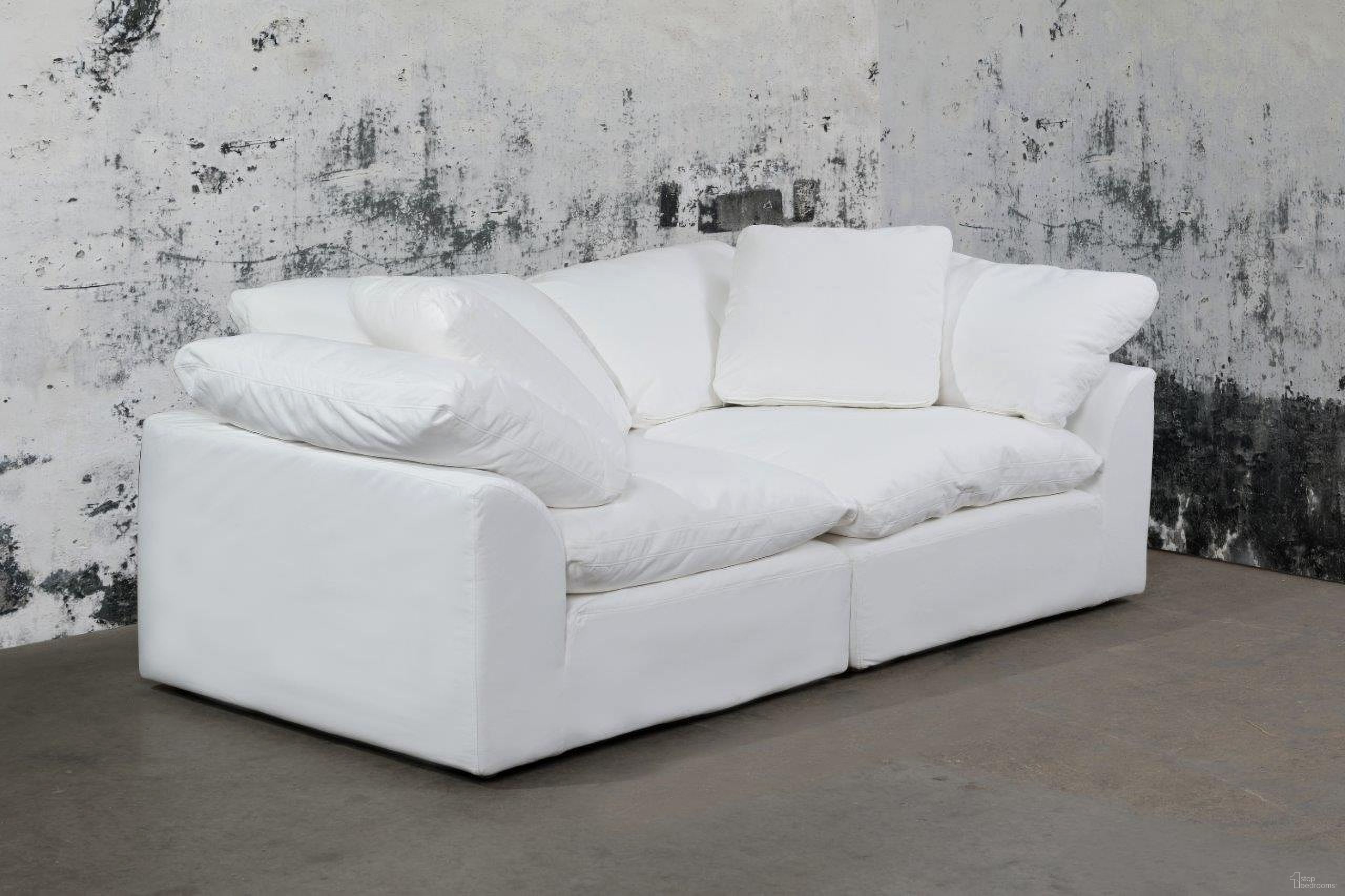 The appearance of Cloud Puff White 2 Piece Slipcovered Modular Sectional Sofa designed by Sunset Trading in the modern / contemporary interior design. This white piece of furniture was selected by 1StopBedrooms from Cloud Puff Collection to add a touch of cosiness and style into your home. Sku: SU-145851-391081;SU-145851-391081. Material: Performance Fabric. Layout: Modular.