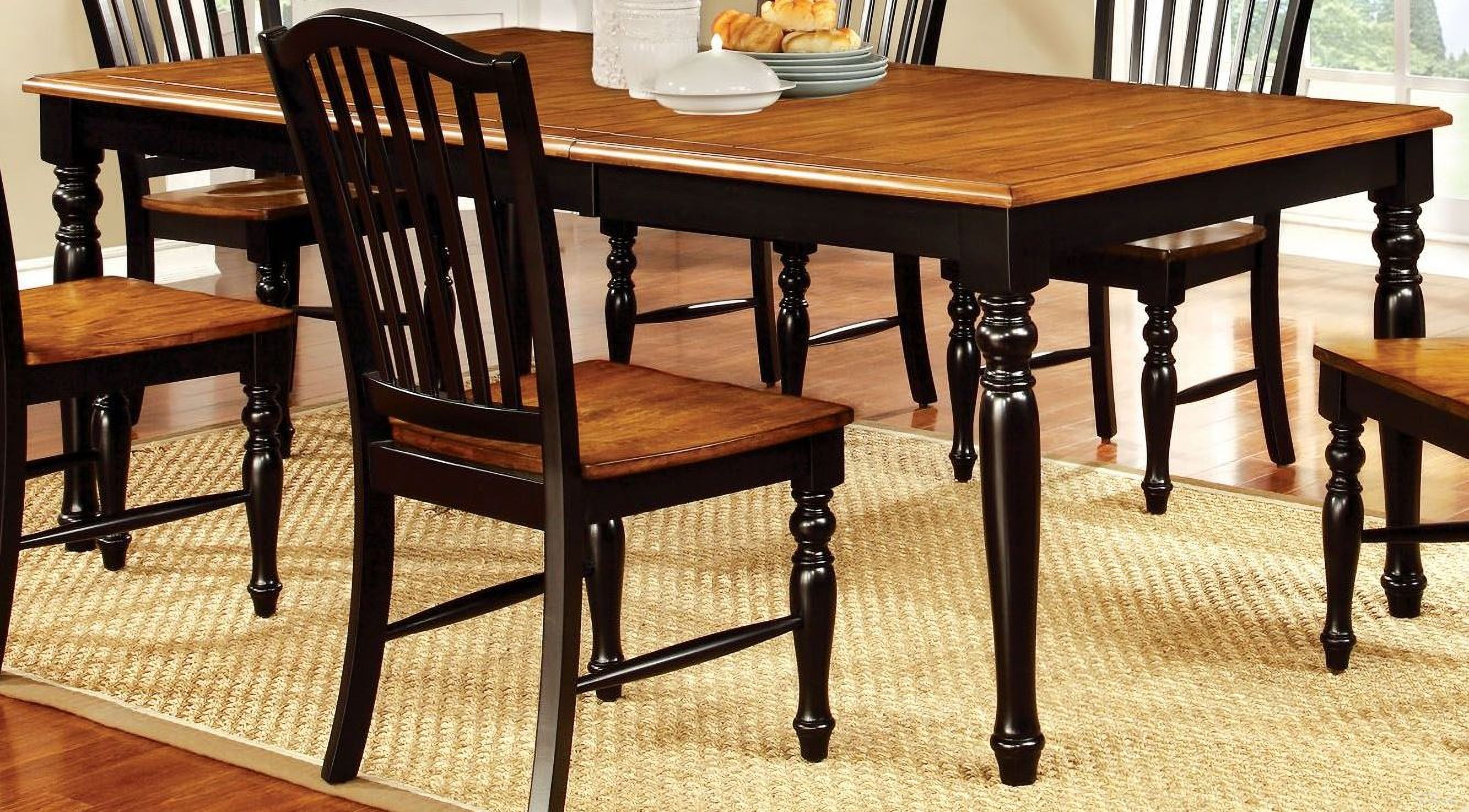 The appearance of Mayville Black and Antique Oak Rectangular Extendable Leg Dining Table designed by Furniture of America in the country / farmhouse interior design. This black and brown piece of furniture  was selected by 1StopBedrooms from Mayville Collection to add a touch of cosiness and style into your home. Sku: CM3431T. Table Base Style: Legs. Material: Wood. Table Top Shape: Rectangular. Size: 78" x 42".