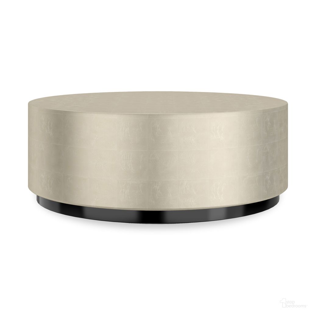 The appearance of Cocktail Couture Round Cocktail Table In Cream designed by Caracole in the modern / contemporary interior design. This cream piece of furniture  was selected by 1StopBedrooms from Cocktail Couture Collection to add a touch of cosiness and style into your home. Sku: CLA-424-404. Material: Hardwood.