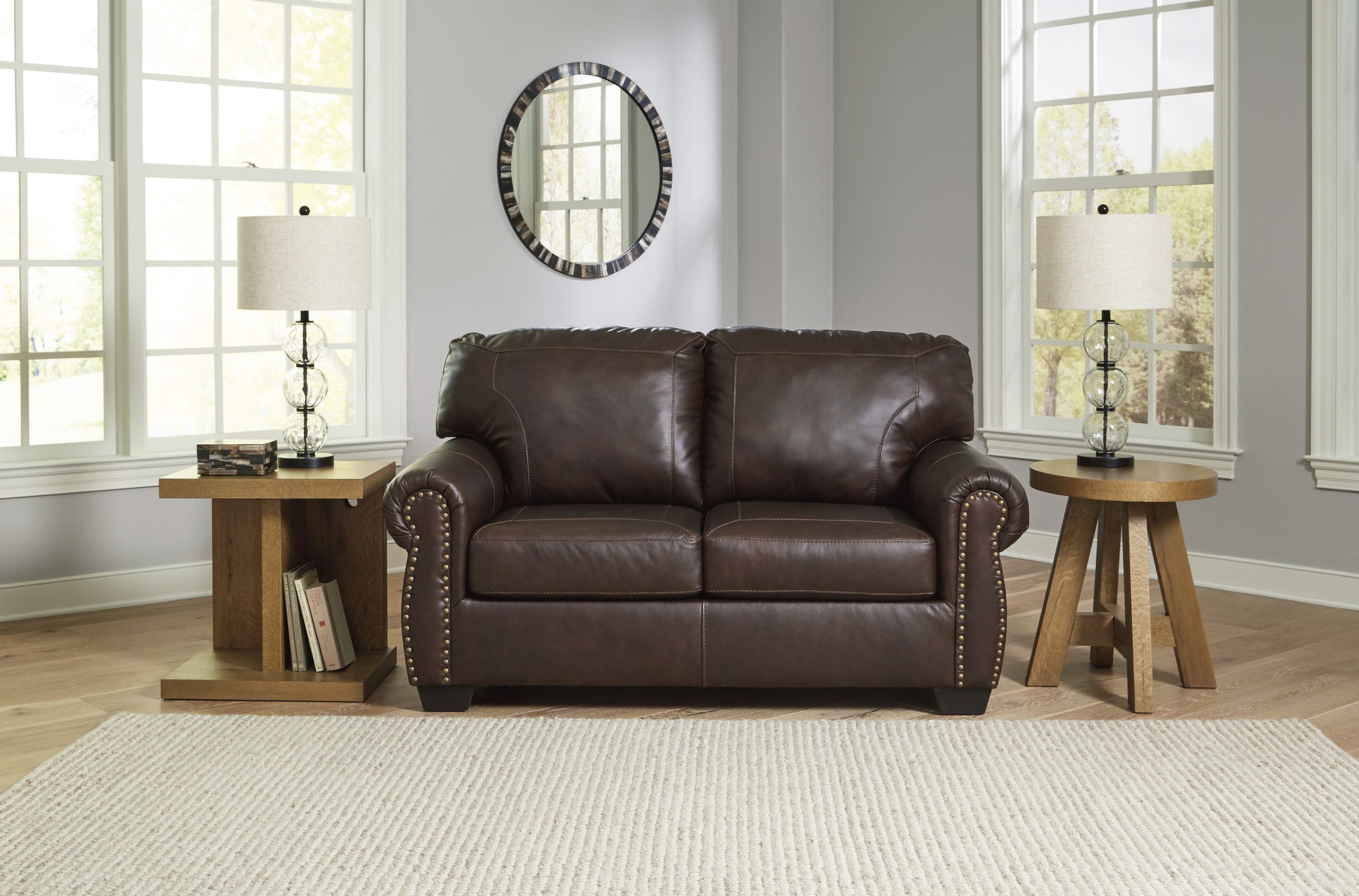 The appearance of Colleton Loveseat In Dark Brown designed by Signature Design by Ashley in the traditional interior design. This dark brown piece of furniture was selected by 1StopBedrooms from Colleton Collection to add a touch of cosiness and style into your home. Sku: 5210735. Material: Faux Leather.