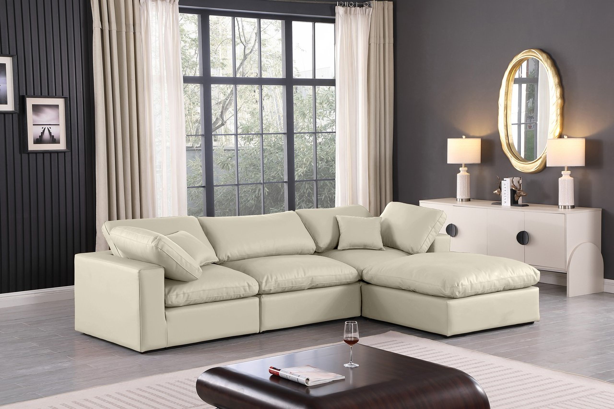 The appearance of Comfy Vegan Leather 4 Piece Modular Sectional In Cream designed by Meridian in the modern / contemporary interior design. This cream piece of furniture  was selected by 1StopBedrooms from Comfy Collection to add a touch of cosiness and style into your home. Sku: 188Cream-Armless;188Cream-Corner;188Cream-Corner;188Cream-Ott. Material: Leather. Layout: Modular.