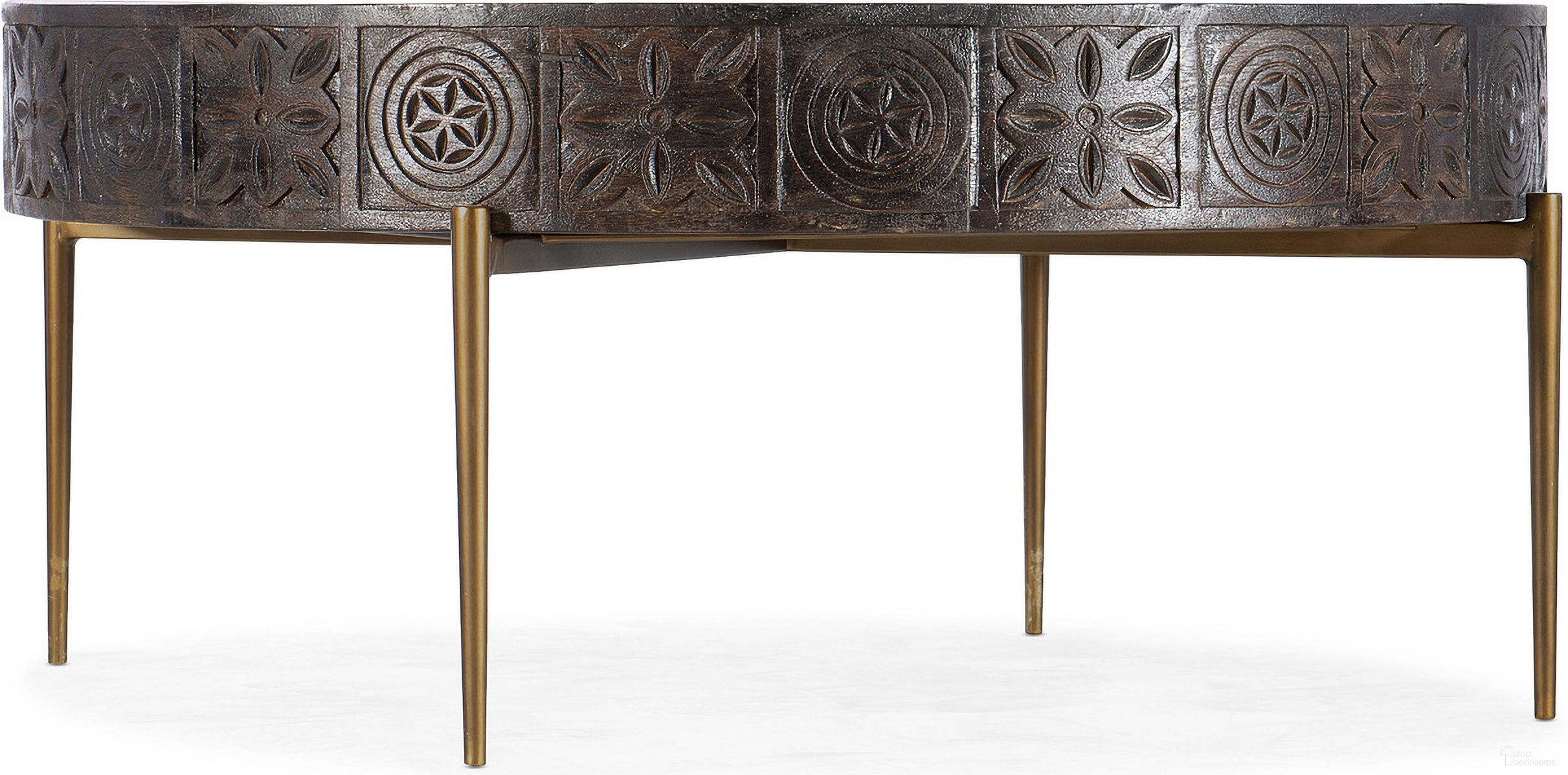 The appearance of Commerce And Market Carved Round Cocktail Table designed by Hooker in the transitional interior design. This dark wood piece of furniture  was selected by 1StopBedrooms from Commerce and Market Collection to add a touch of cosiness and style into your home. Sku: 7228-80030-85. Material: Mango Wood.