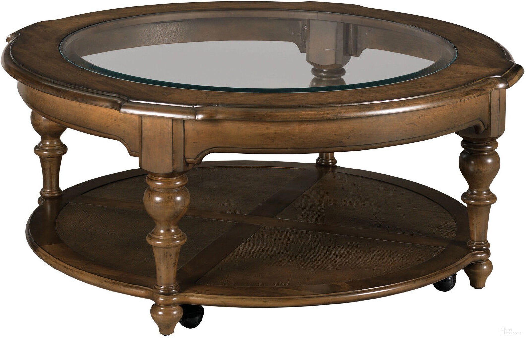 The appearance of Commonwealth Corso Round Coffee Table In Warm Brunette designed by Kincaid in the interior design. This warm brunette piece of furniture was selected by 1StopBedrooms from Commonwealth Collection to add a touch of cosiness and style into your home. Sku: 161-911. Material: Solid Wood.