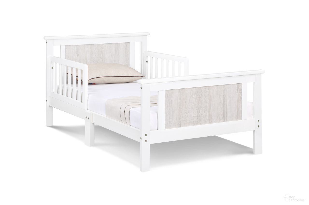 The appearance of Connelly Reversible Panel Toddler Bed In White and Rockport Gray designed by Olive and Opie in the transitional interior design. This white/rockport gray piece of furniture  was selected by 1StopBedrooms from Connelly Collection to add a touch of cosiness and style into your home. Sku: 27510-WH. Material: Wood.