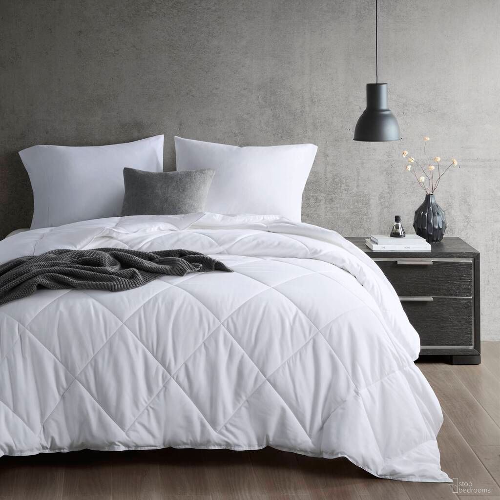The appearance of Cooling Touch Oversized Down Alternative King/Cal King Comforter In White designed by Olliix in the transitional interior design. This white piece of furniture was selected by 1StopBedrooms from Cooling Touch Collection to add a touch of cosiness and style into your home. Sku: SI10-0020. Bed Size: King. Material: Nylon.